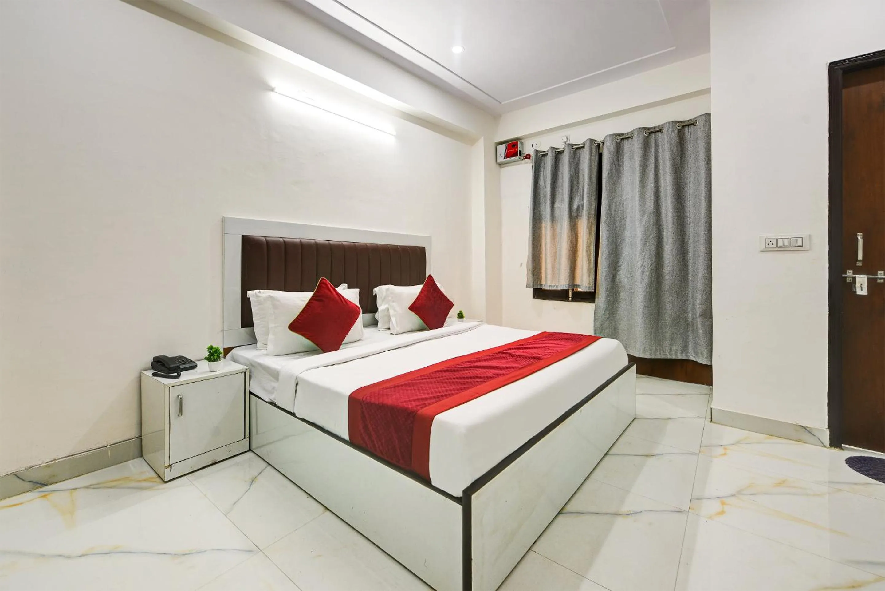 Bed in Hotel Krishna Tower