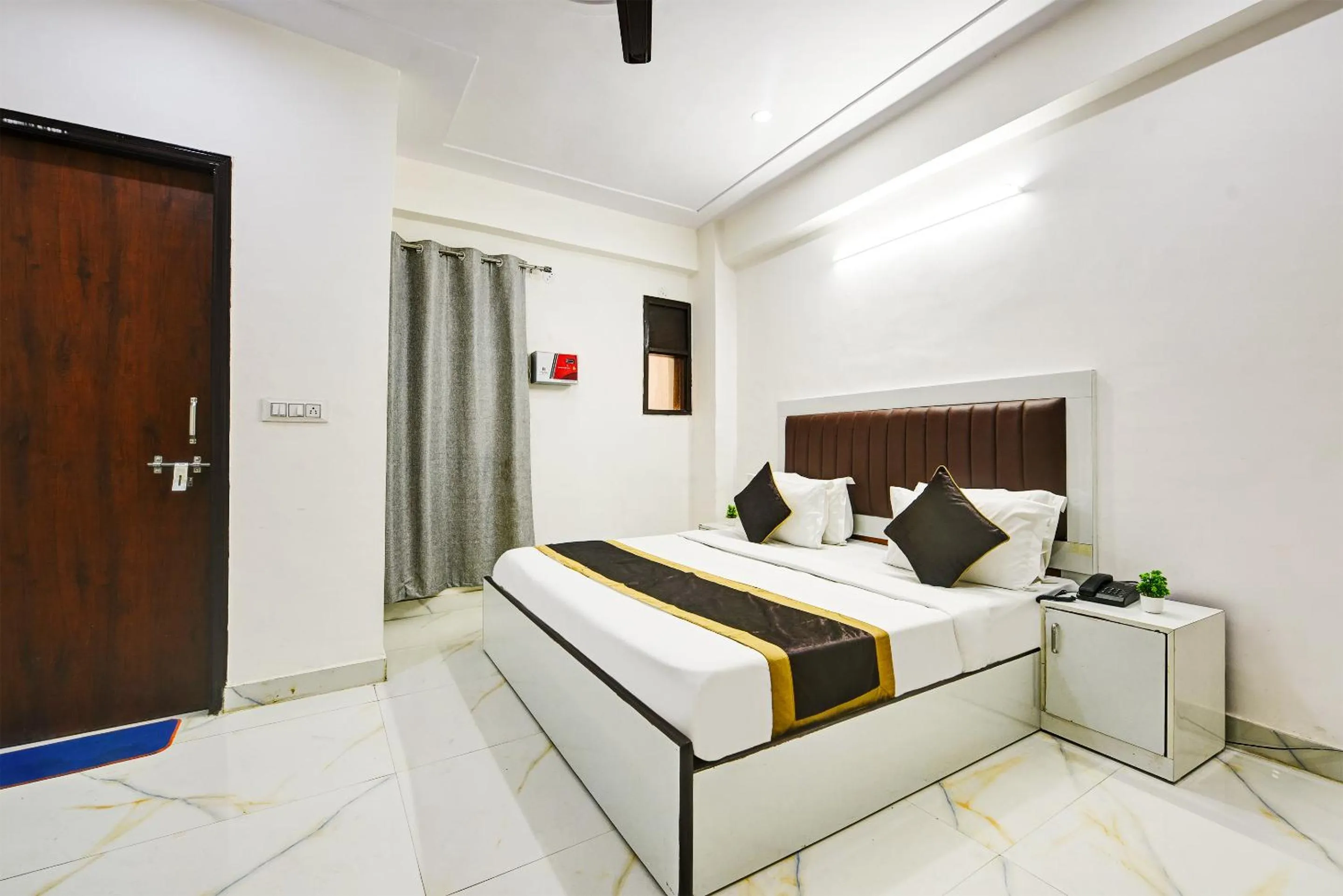 Bed in Hotel Krishna Tower