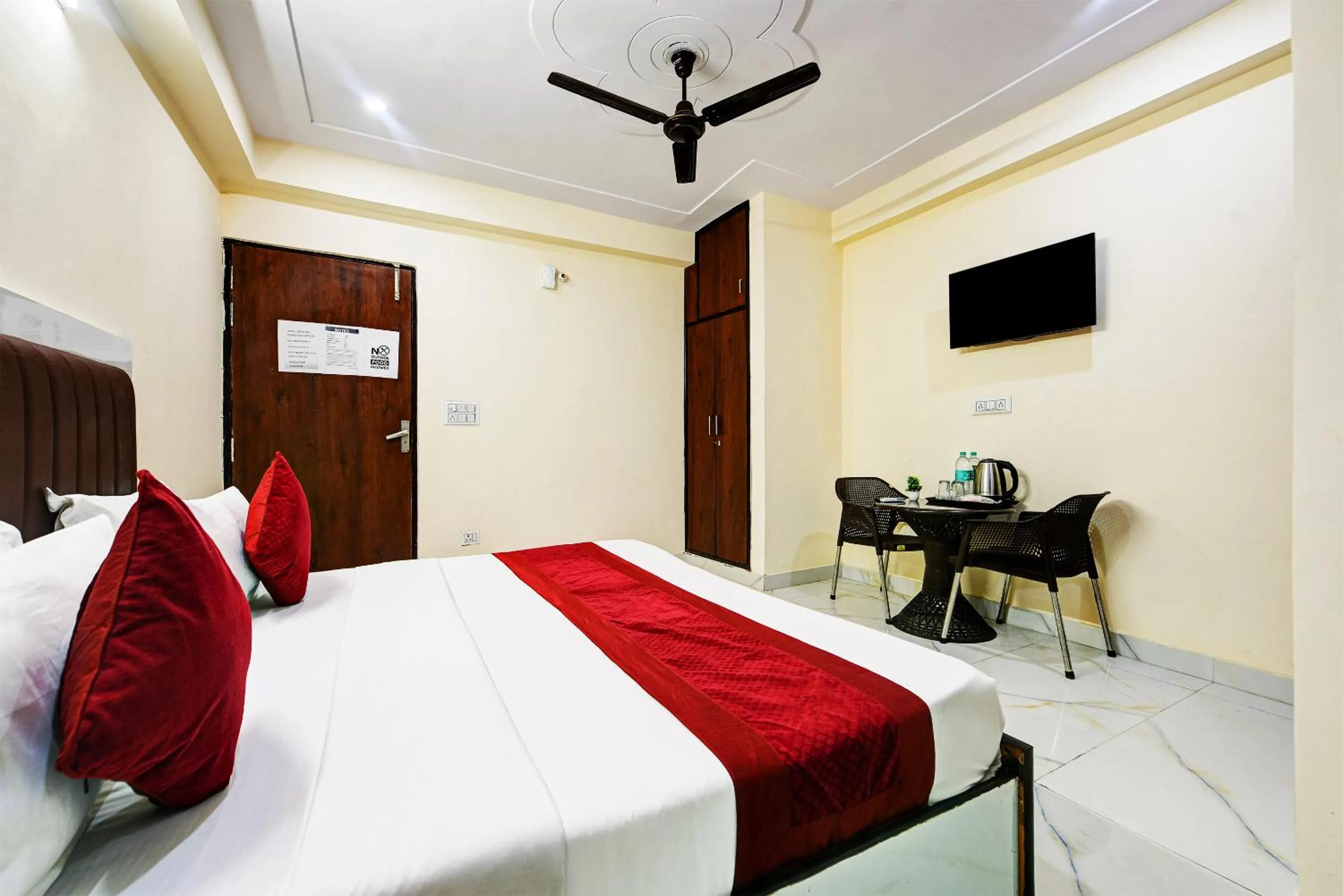 Bed in Hotel Krishna Tower