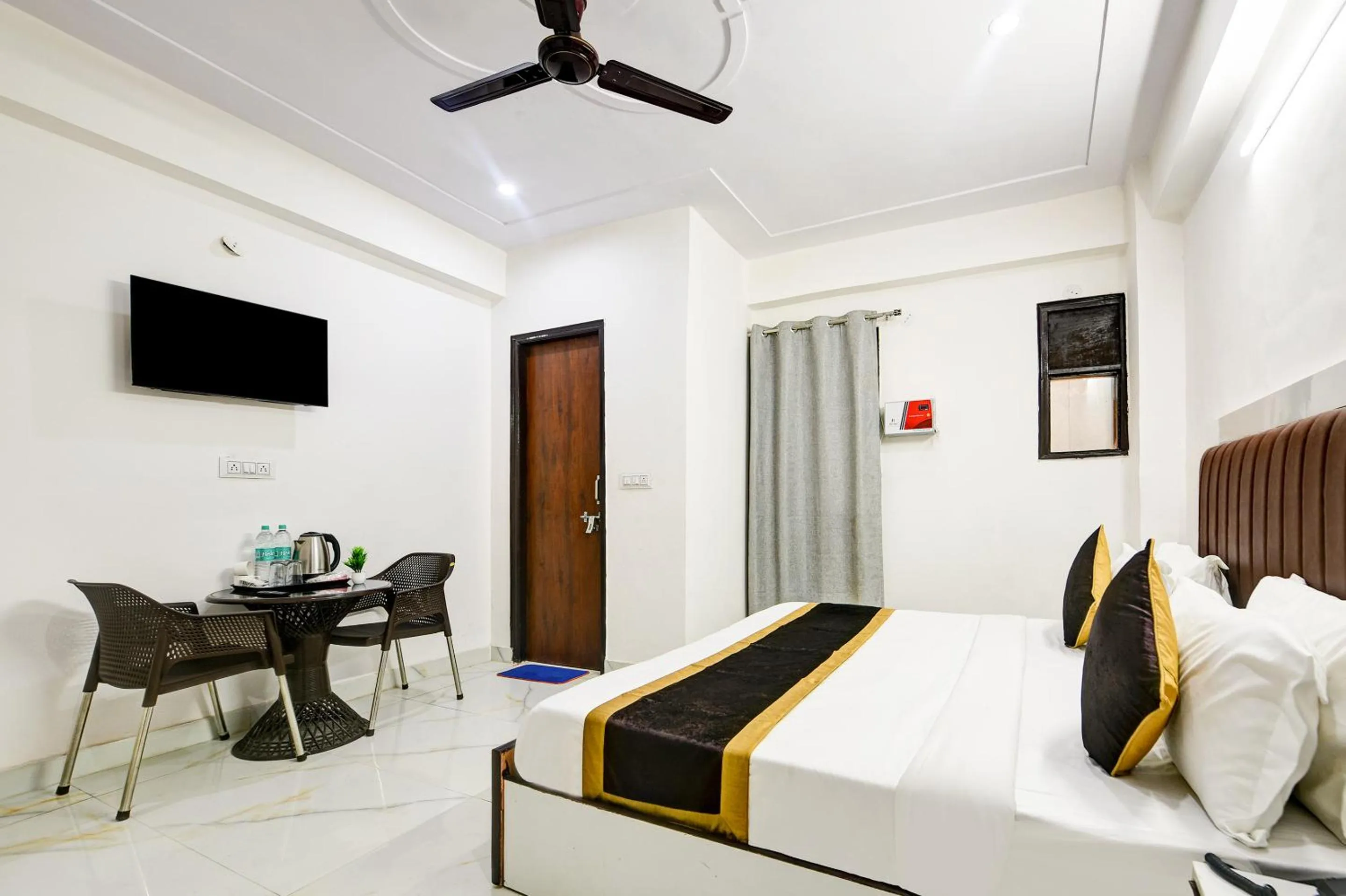 Bed in Hotel Krishna Tower