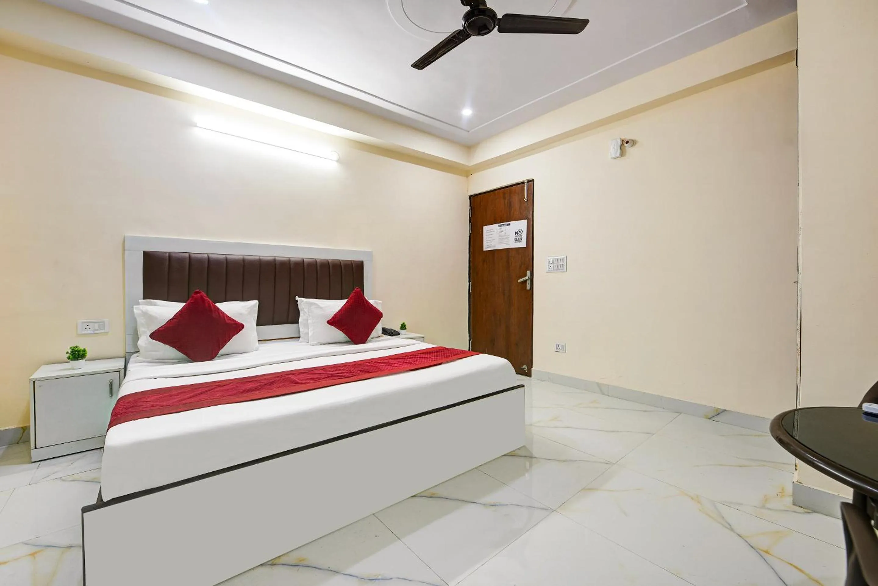 Bed in Hotel Krishna Tower