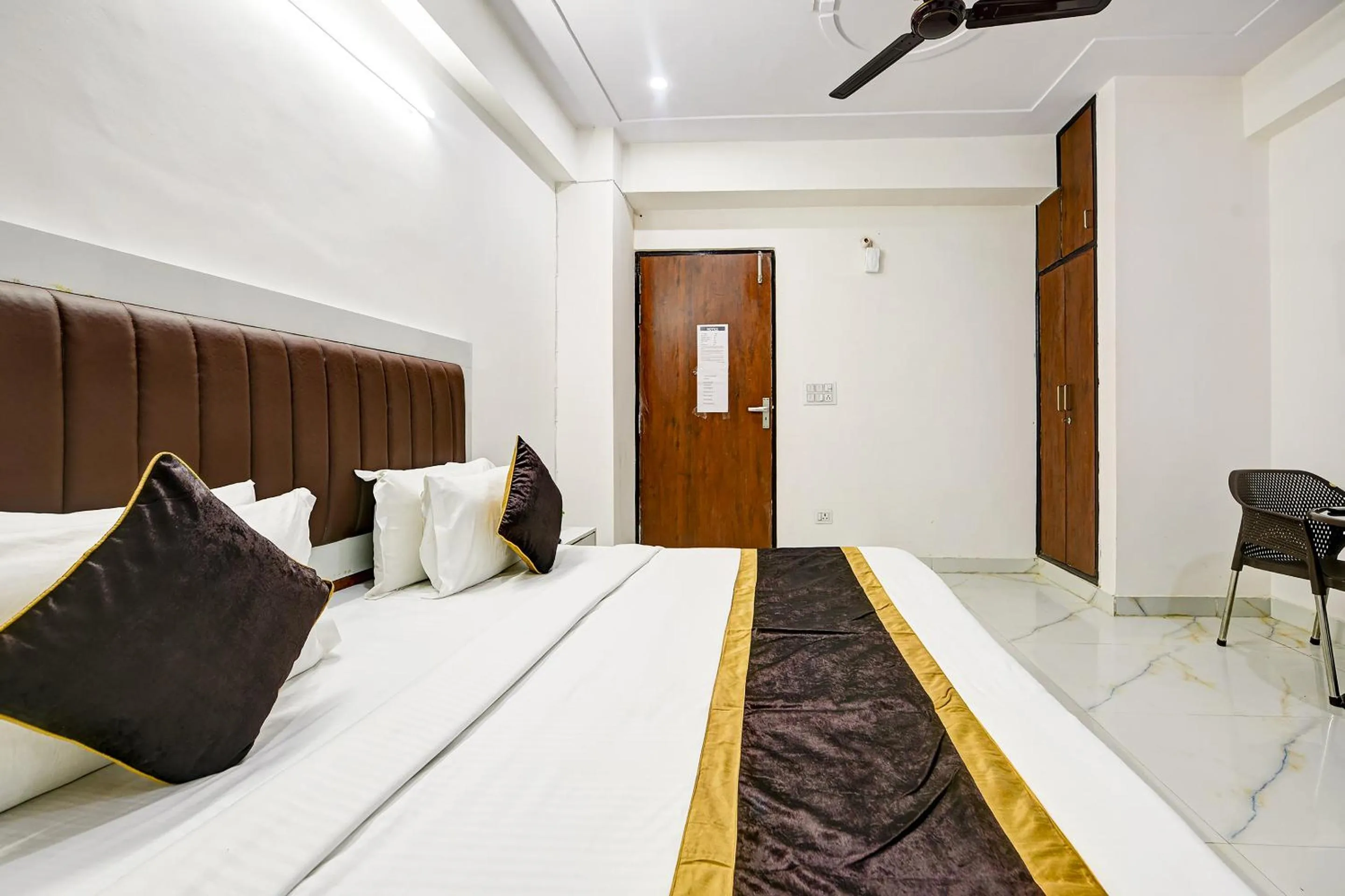 Bed in Hotel Krishna Tower