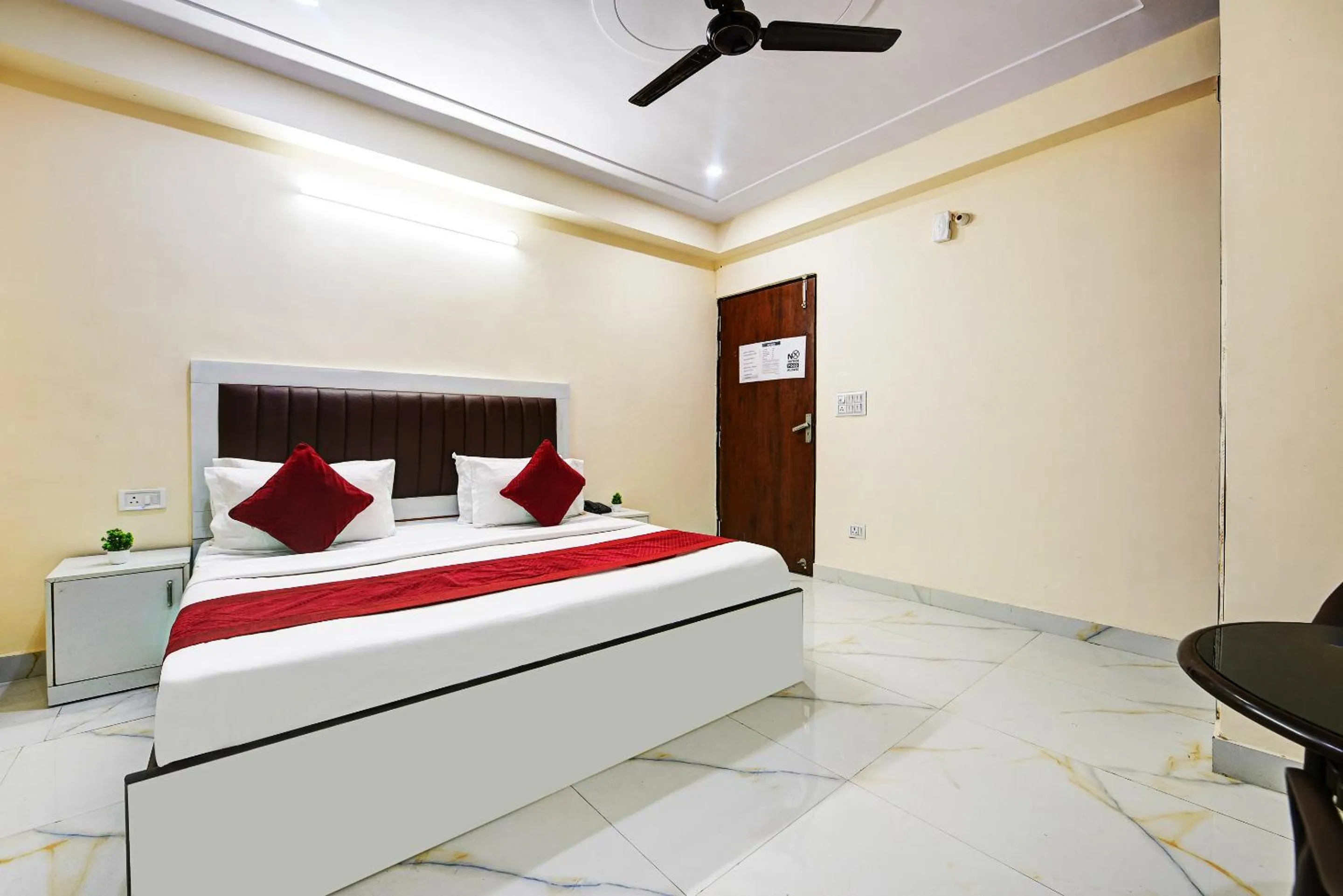 Bed in Hotel Krishna Tower