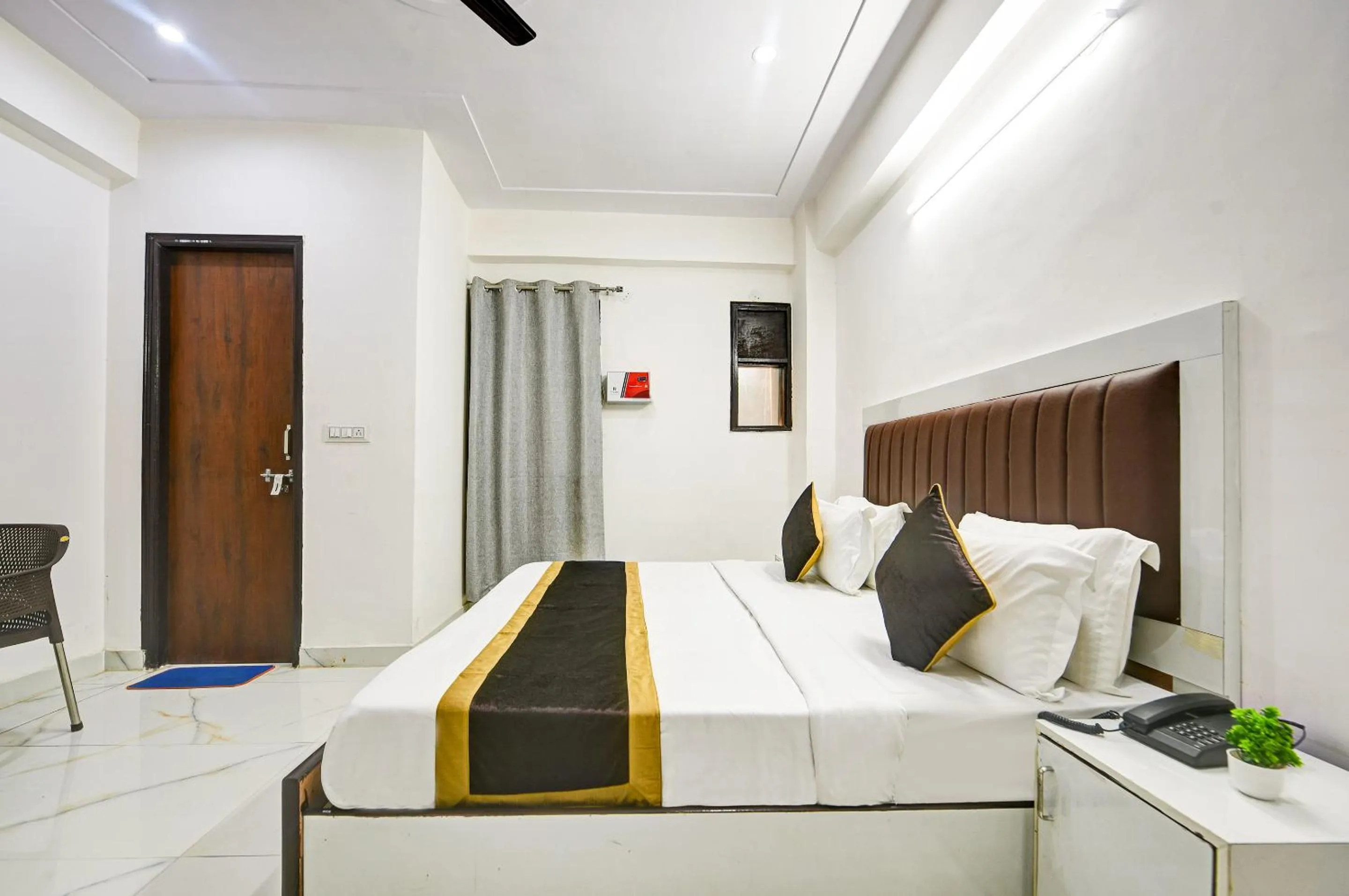 Bed in Hotel Krishna Tower