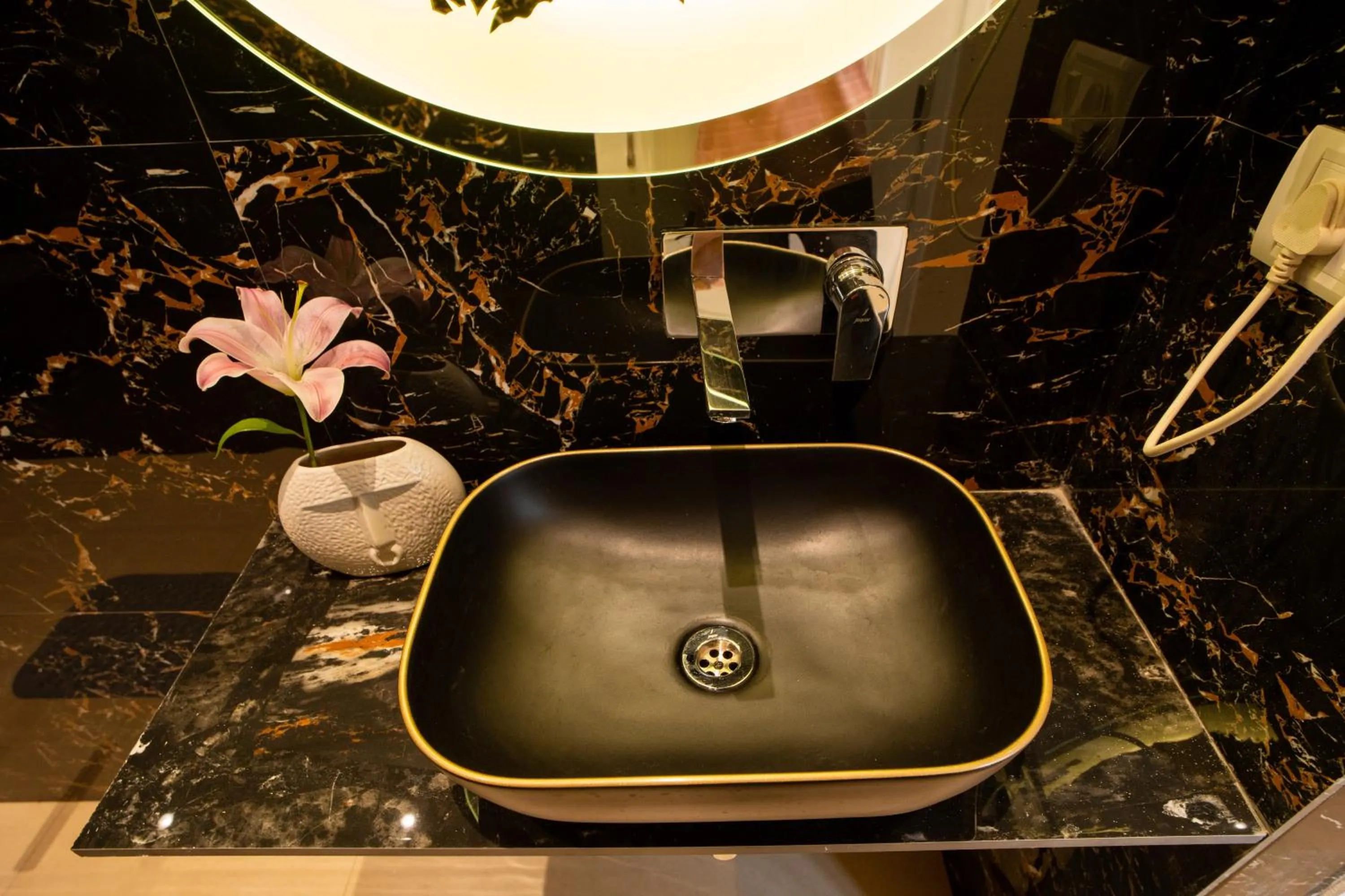 Bathroom in Emperor Ozran by Alaya Stays