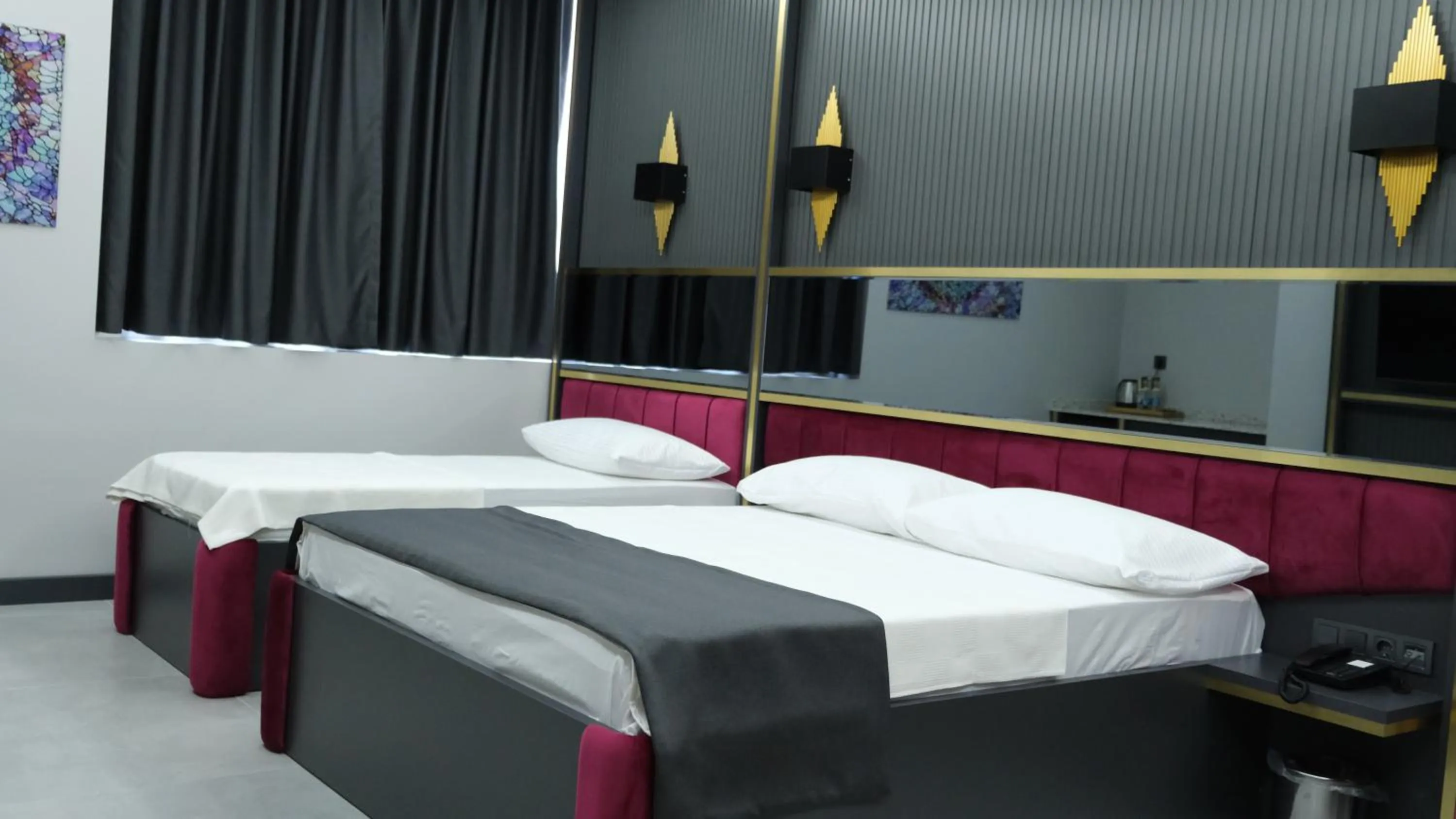 Bed in 216 Prestige Hotel