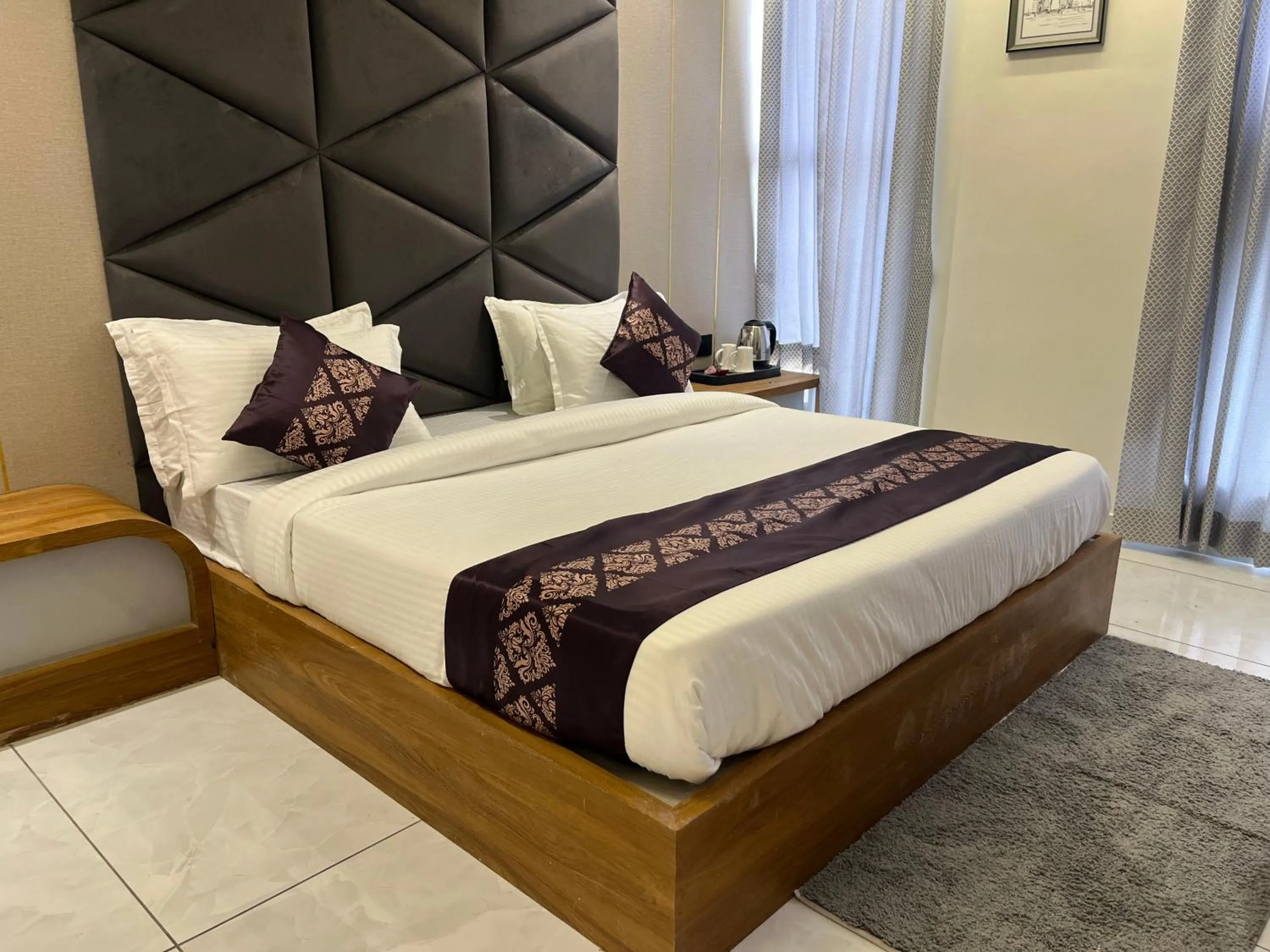 Bed in Hotel Royal Empire