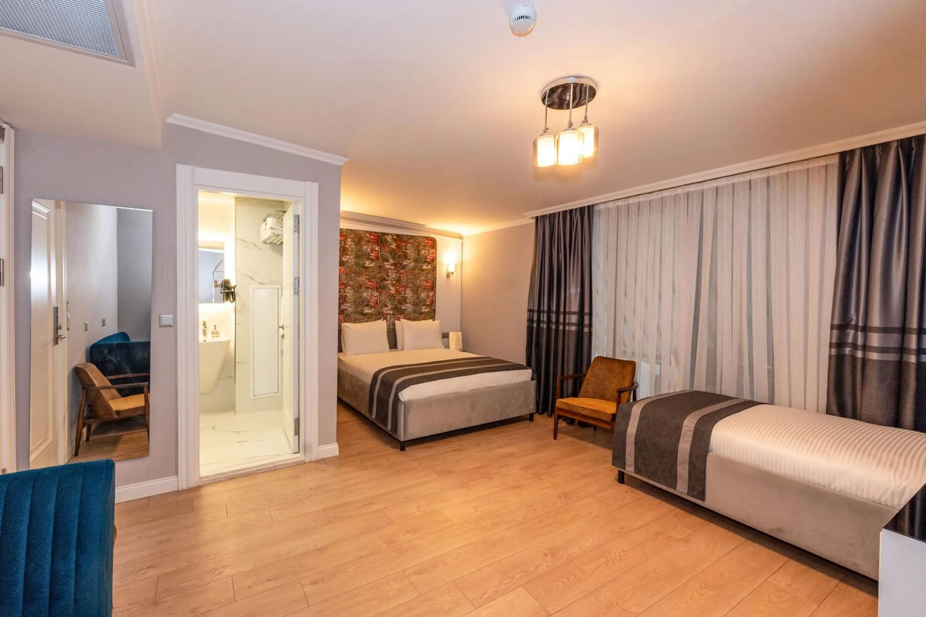 Toilet, Bed in The Now Hotel