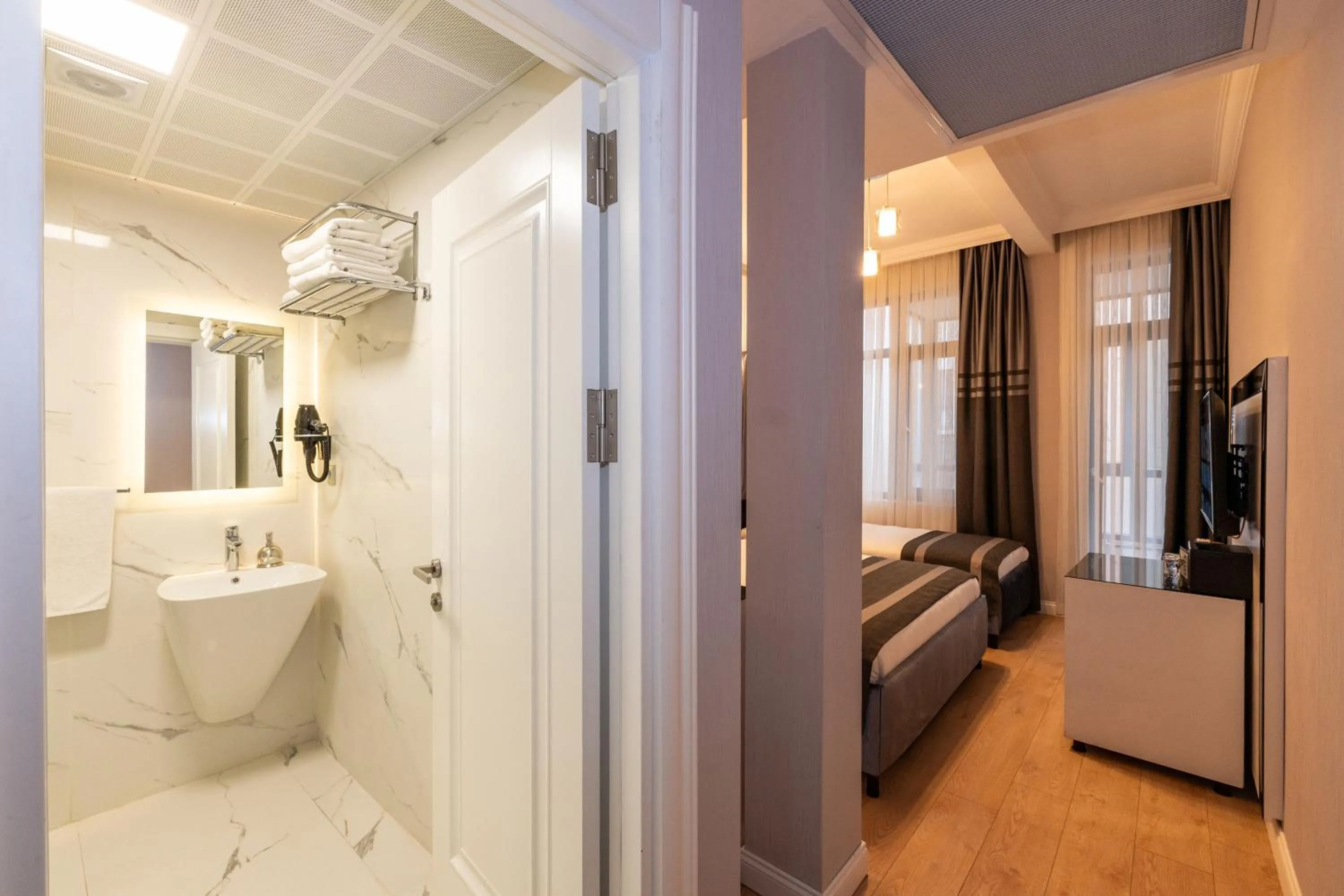 Toilet, Bed in The Now Hotel