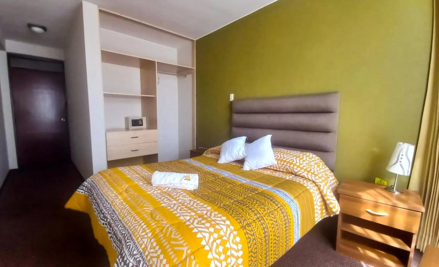 Bed in Hotel San Felipe Suites