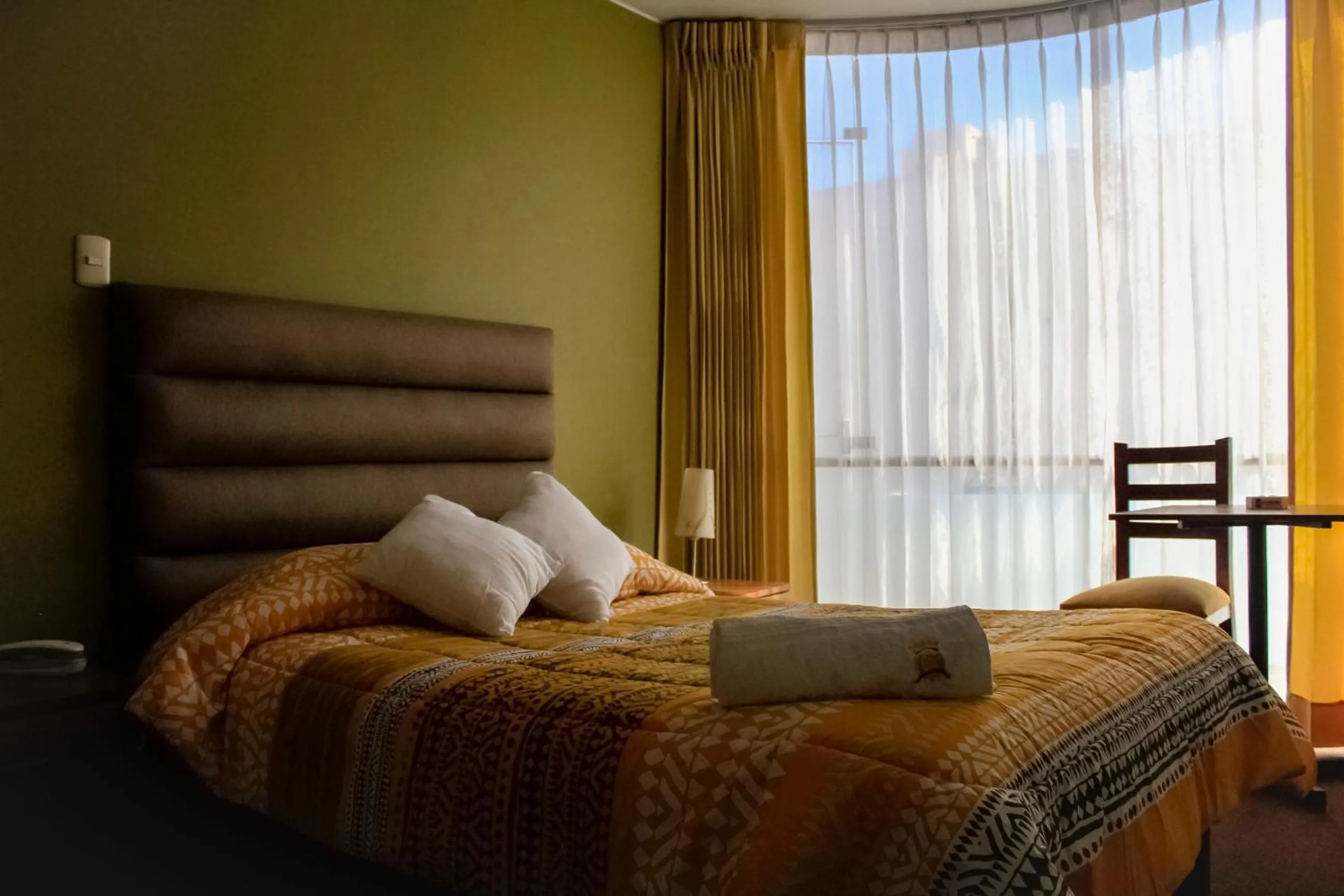 Bed in Hotel San Felipe Suites