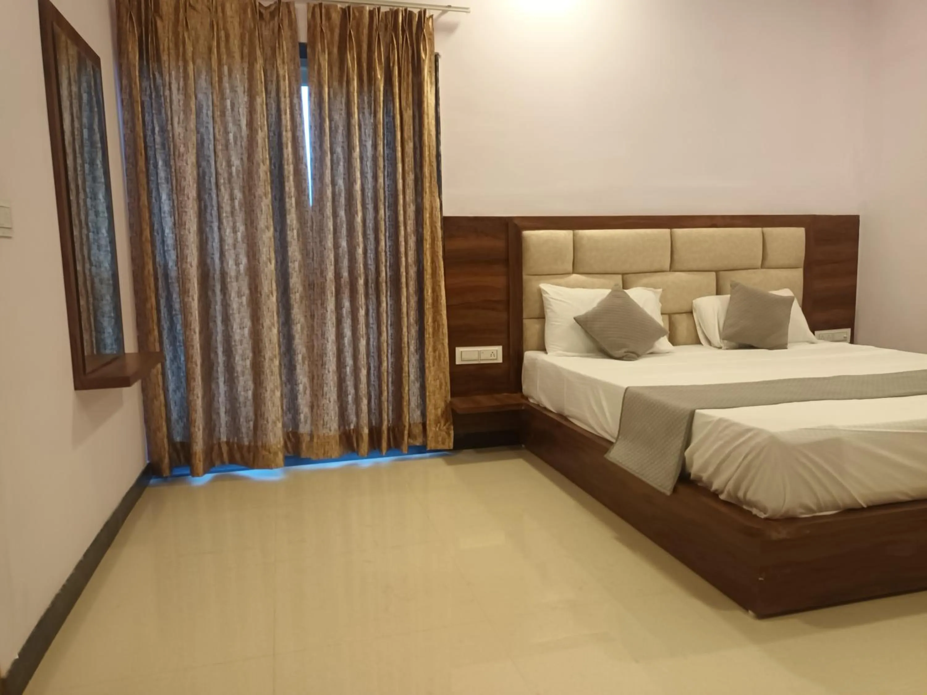 Bed in Braham Vatika Resort