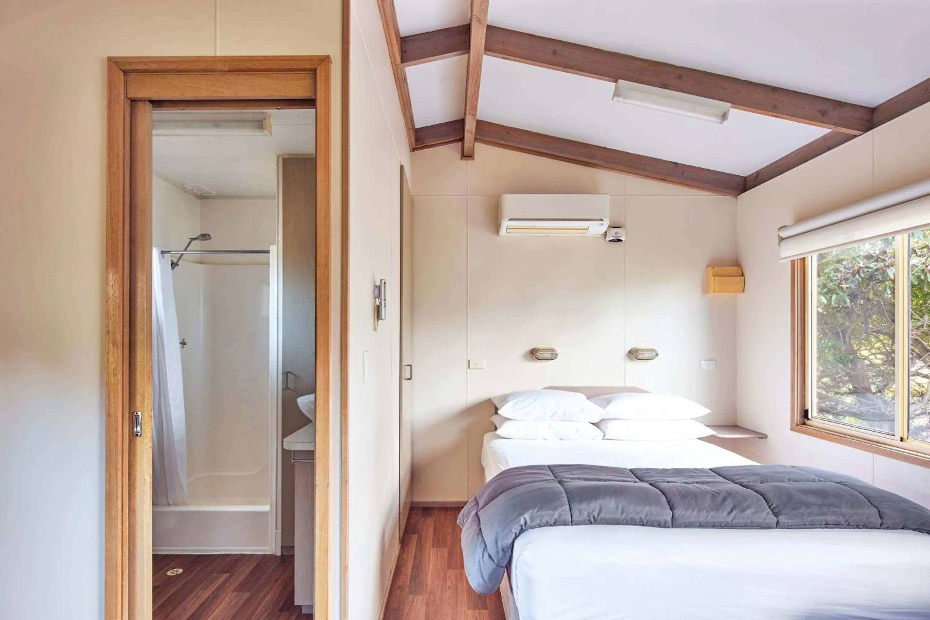 Photo of the whole room, Bed in NRMA Merimbula Beach Holiday Resort