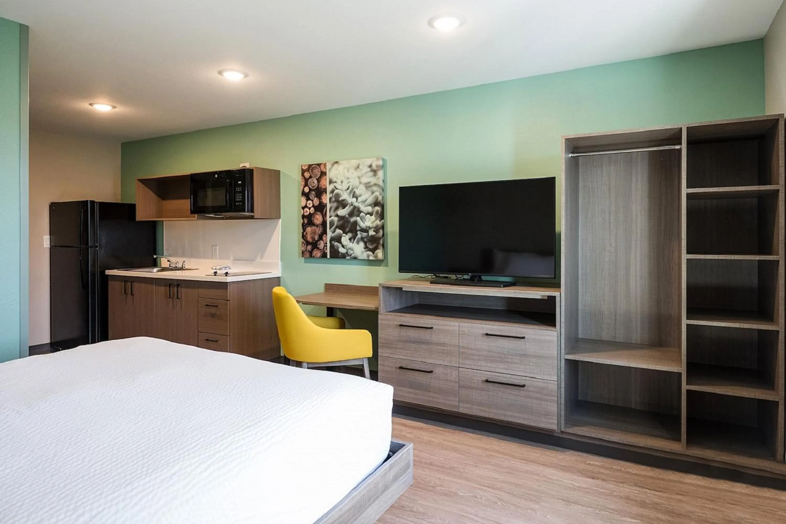 Photo of the whole room, Bed in ECHO Suites Extended Stay by Wyndham Dallas Plano - Frisco