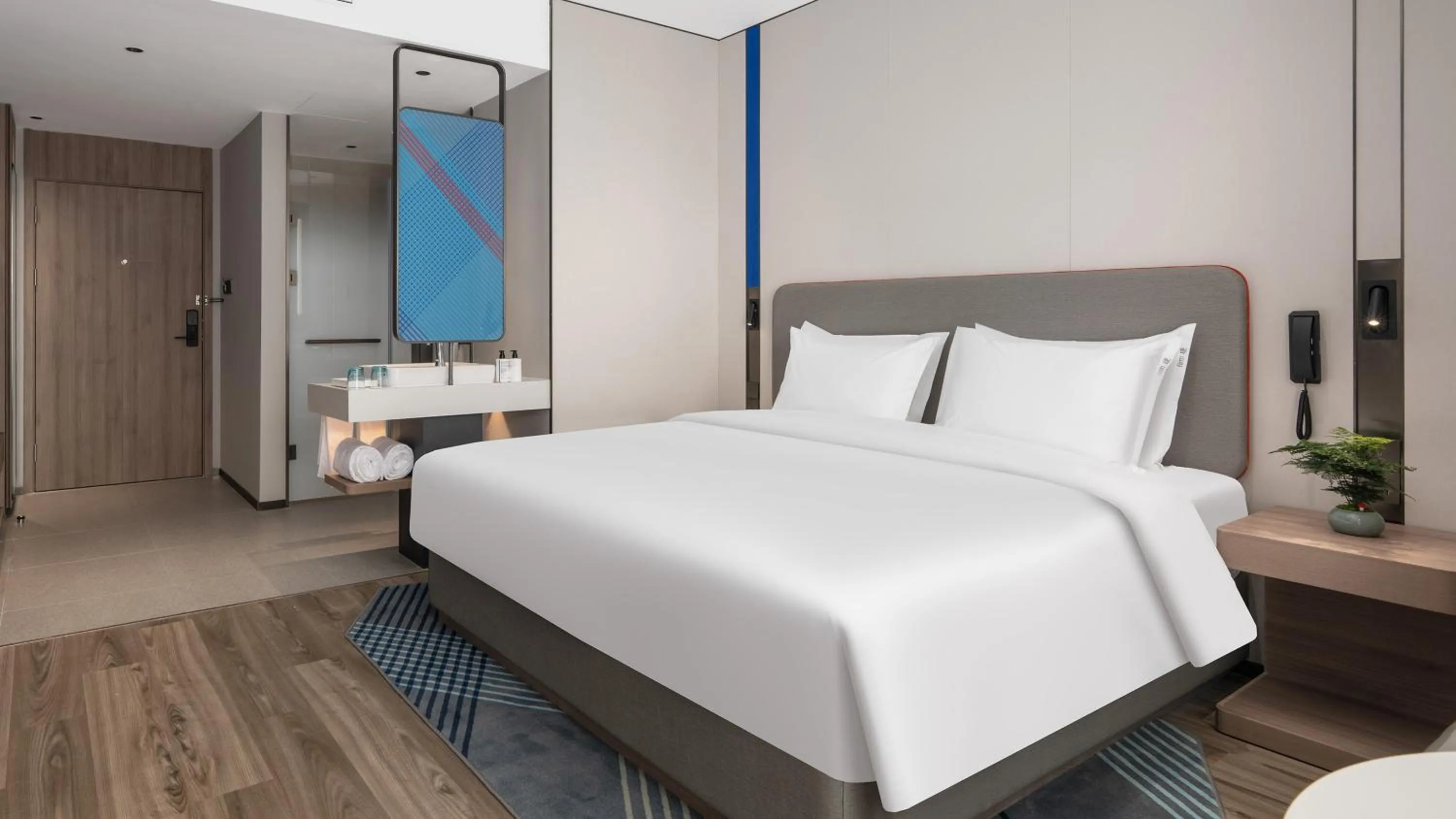 Decorative detail, Bed in Holiday Inn Express Qingdao Hongdao Station by IHG - Qingdao International Airport