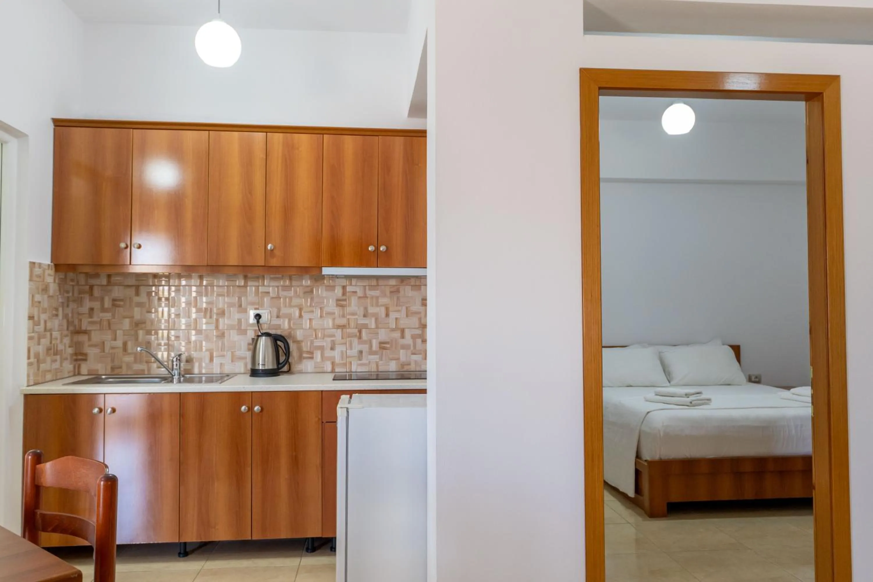 Kitchen or kitchenette, Bed in Aleksander ApartHotel