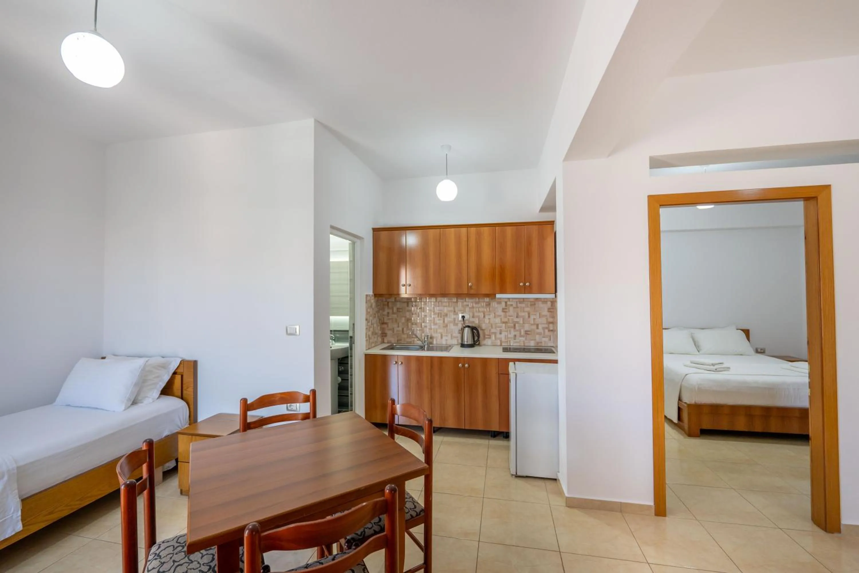 Kitchen or kitchenette, Bed in Aleksander ApartHotel