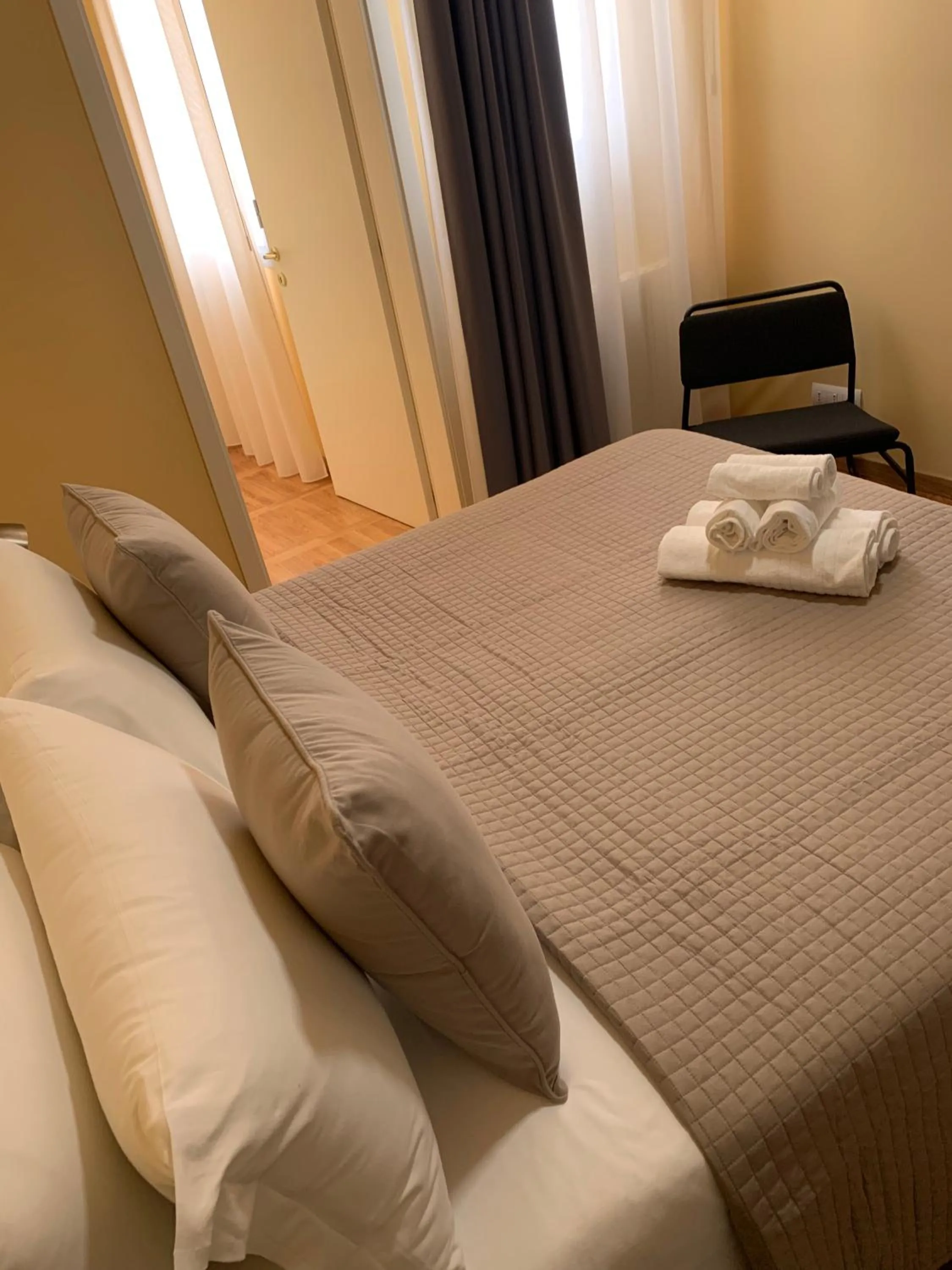 Bed in Apartment Hotel Marchesini