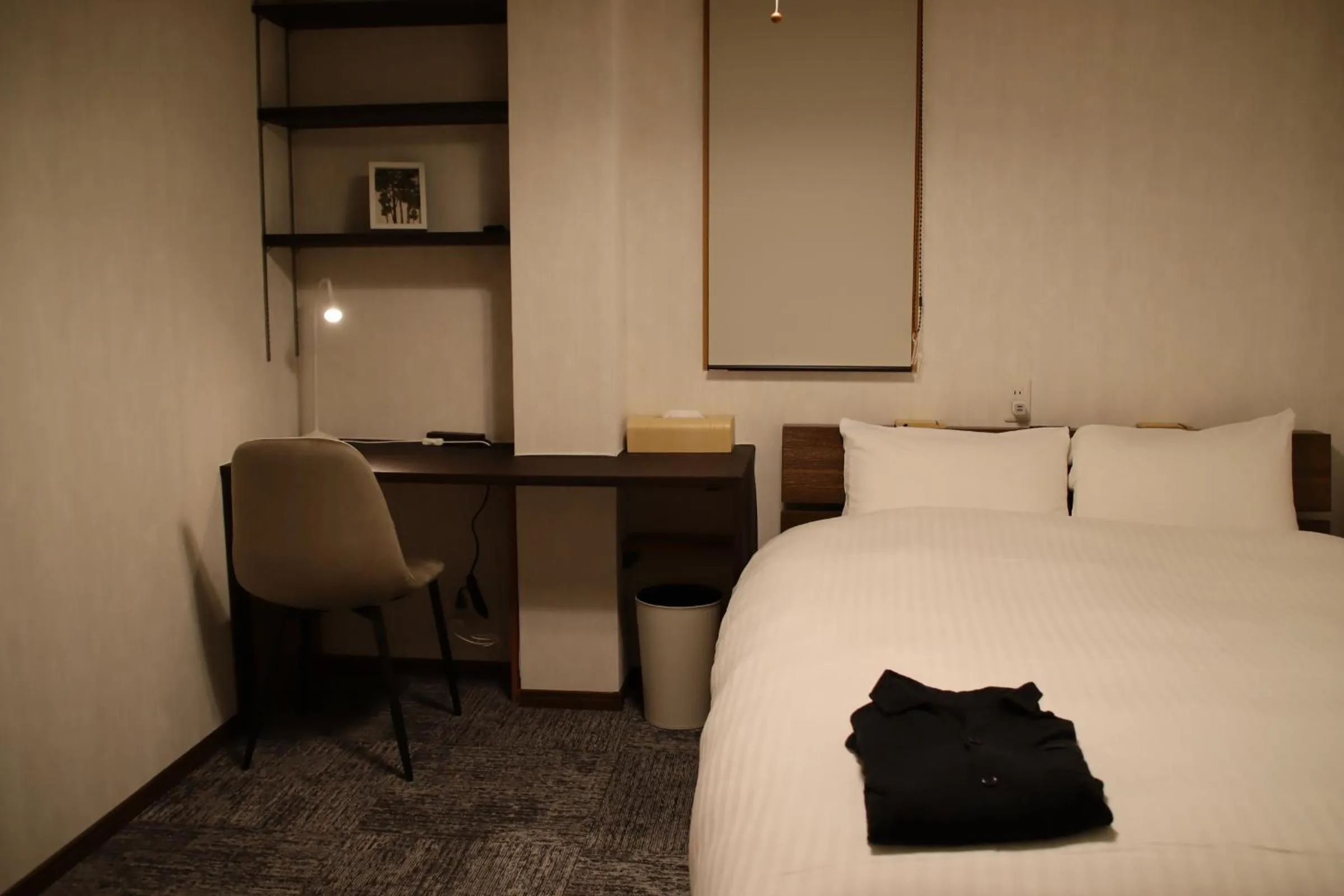 Bed in ritomaru rooms hakata hakozaki