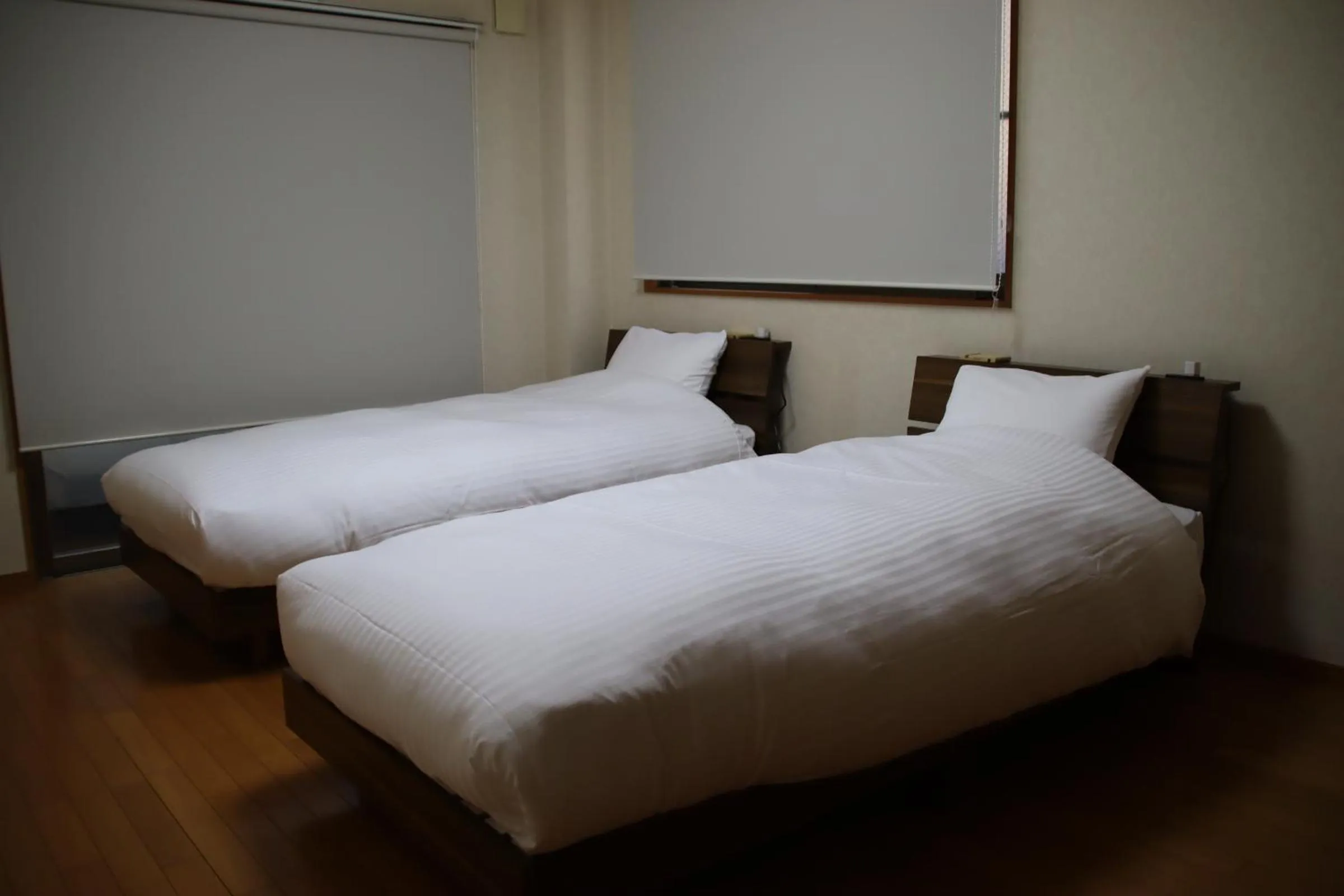 Bed in ritomaru rooms hakata hakozaki