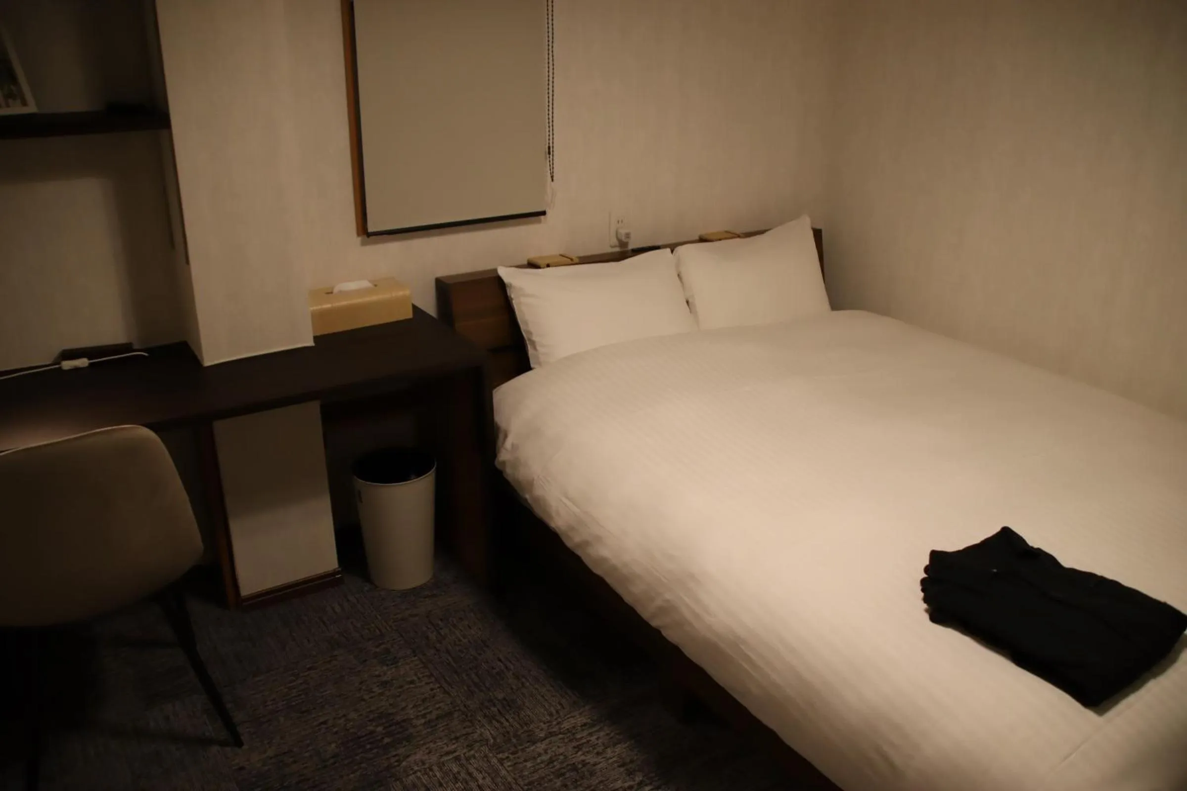 Bed in ritomaru rooms hakata hakozaki