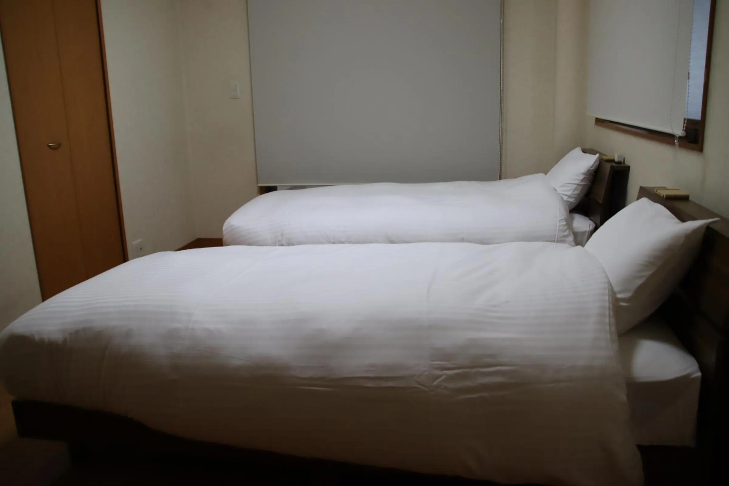 Bed in ritomaru rooms hakata hakozaki