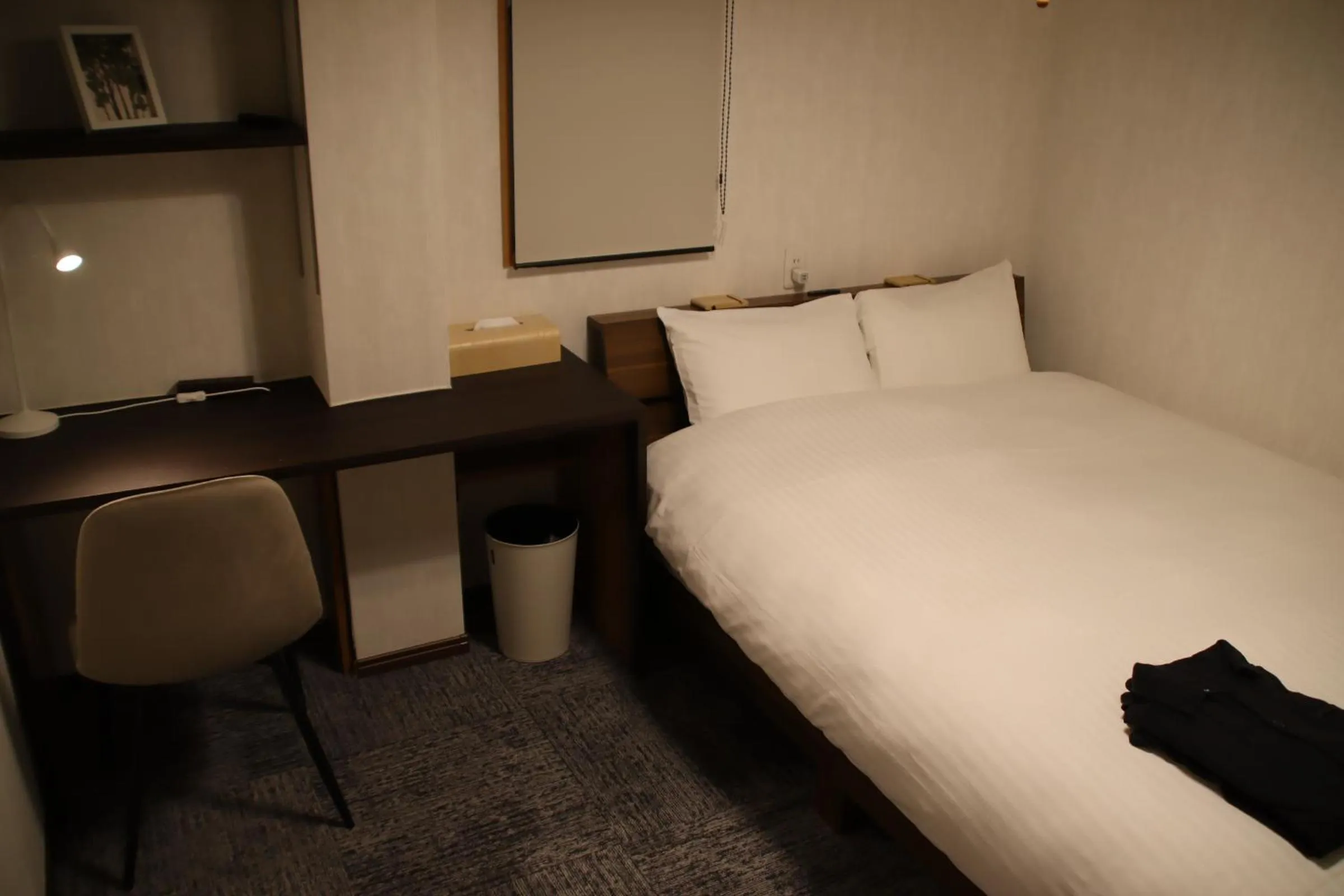 Bed in ritomaru rooms hakata hakozaki