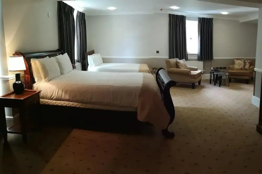 Bed in The Tudor Hotel