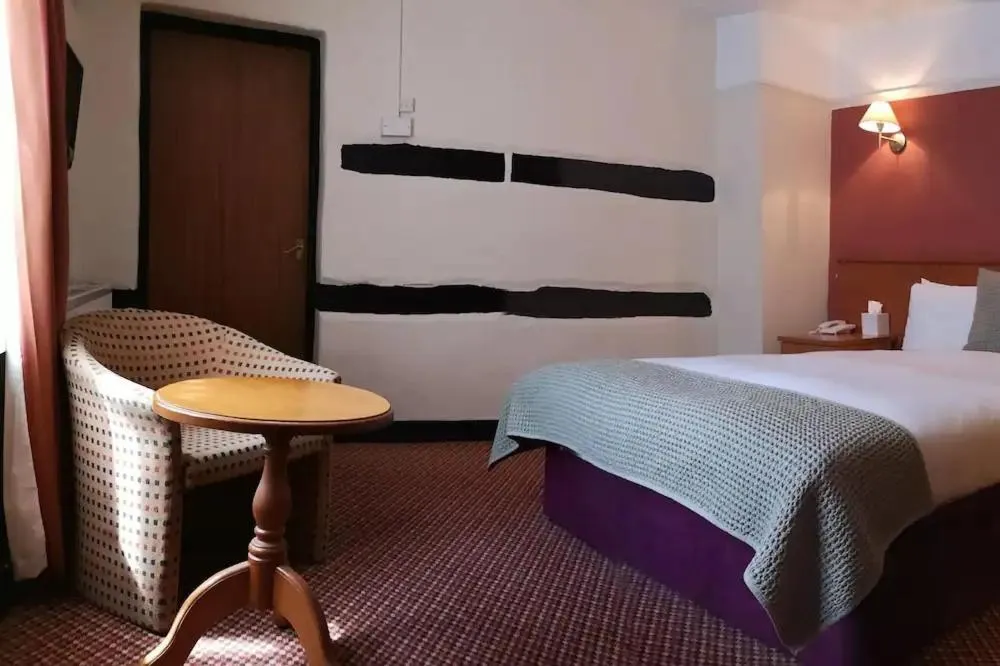 Bed in The Tudor Hotel