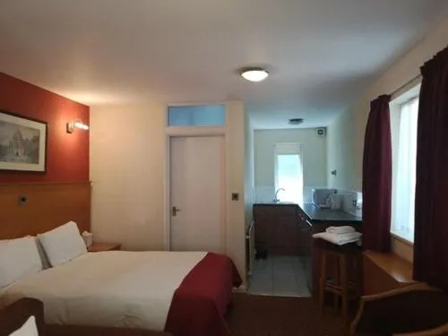 Bed in The Tudor Hotel