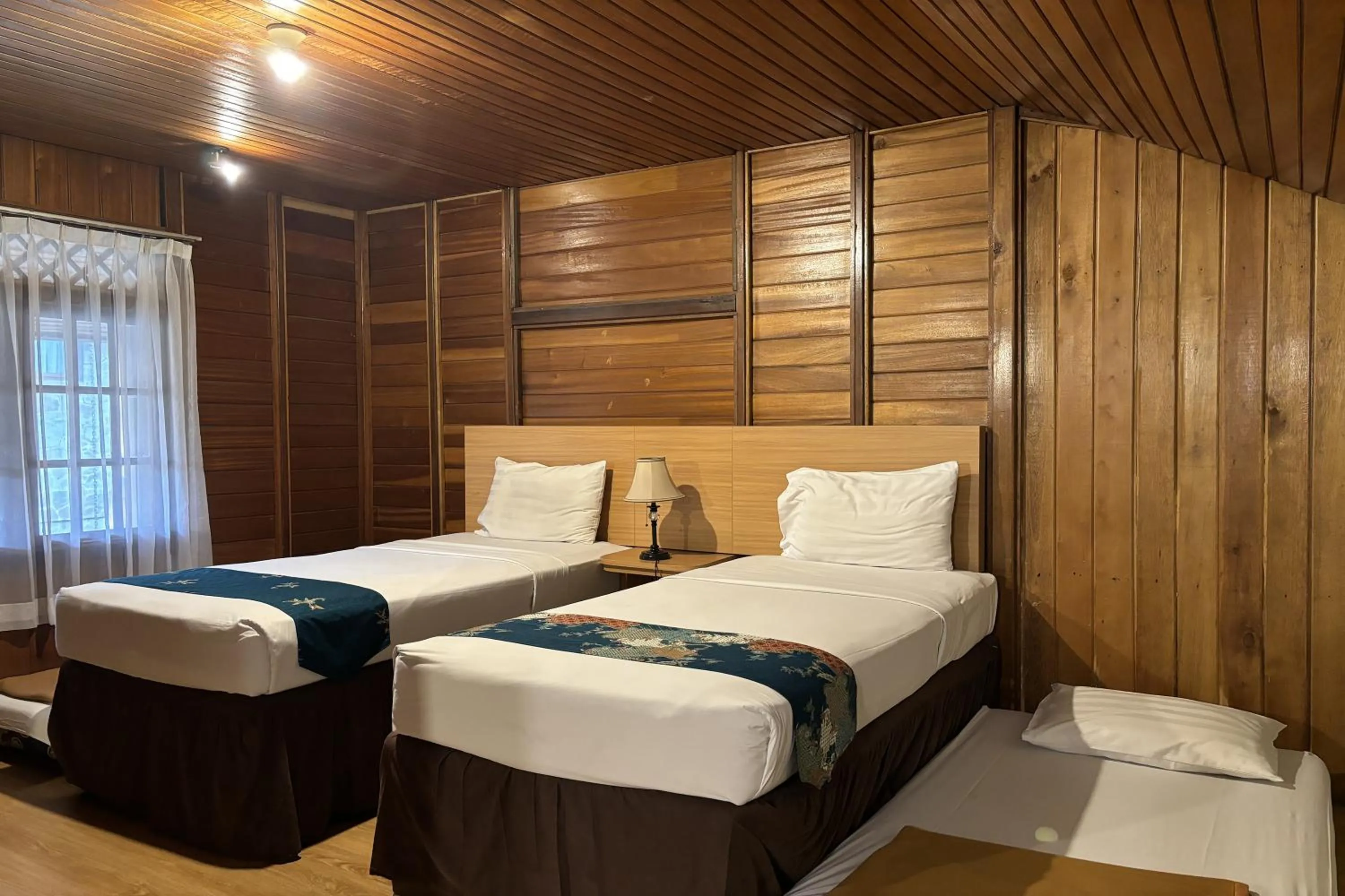 Bed in Hotel Pesona Bamboe Lembang