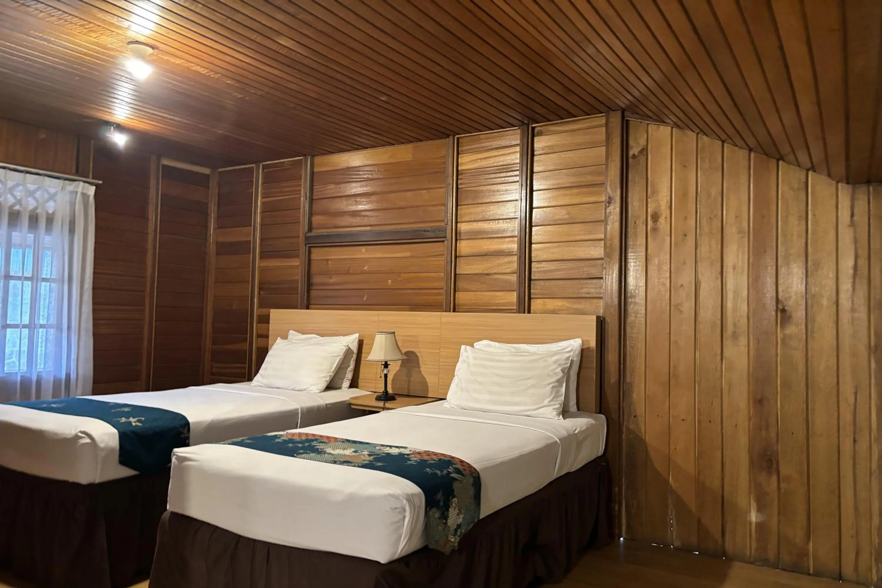 Bed in Hotel Pesona Bamboe Lembang