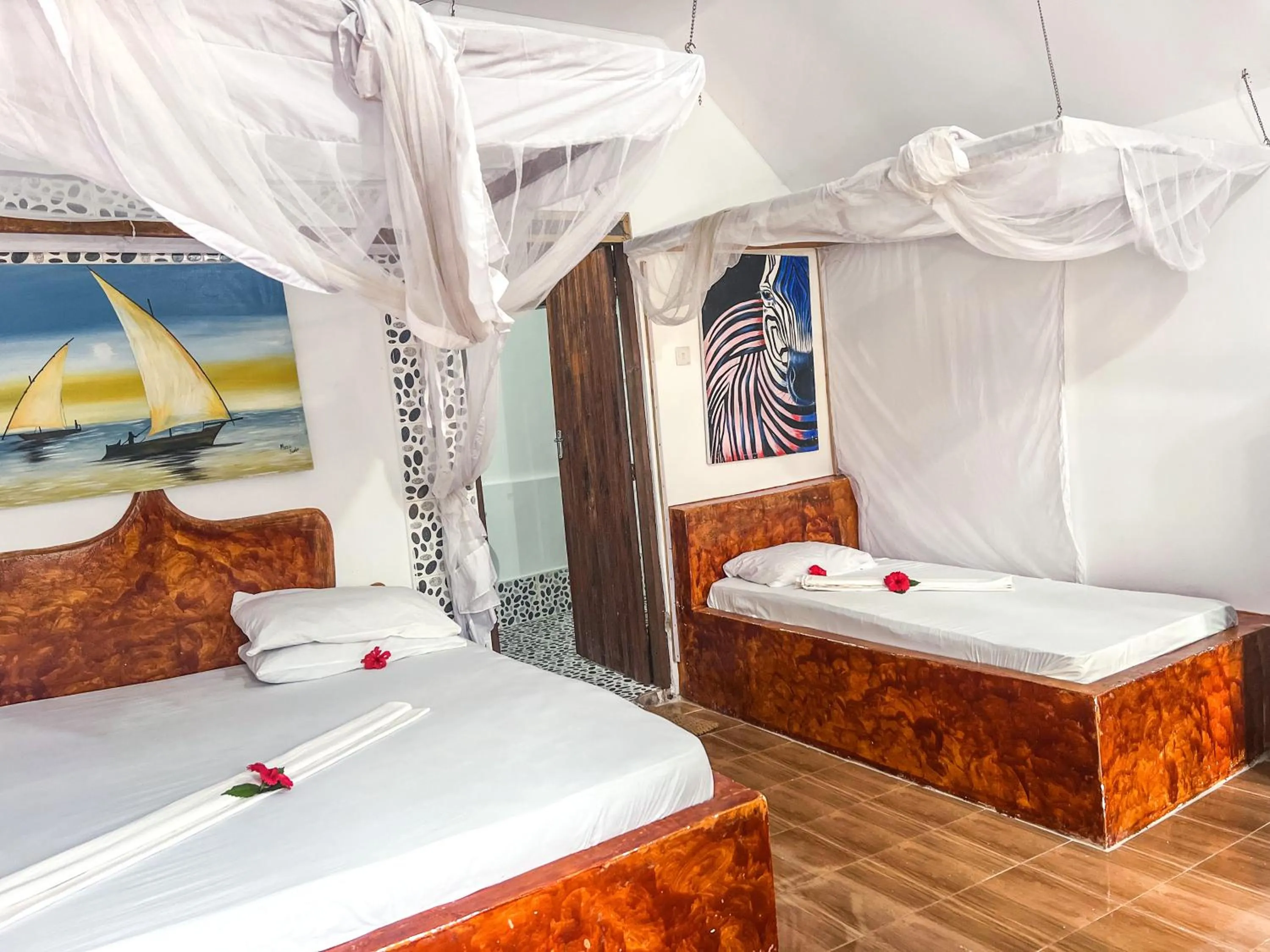 Bed in New Jambo Bungalows