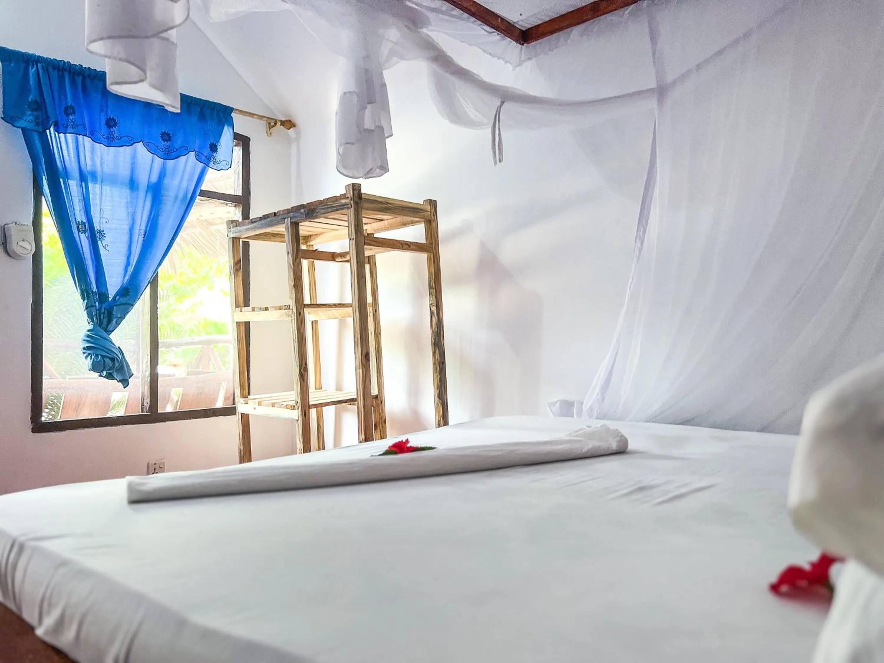 Bed in New Jambo Bungalows