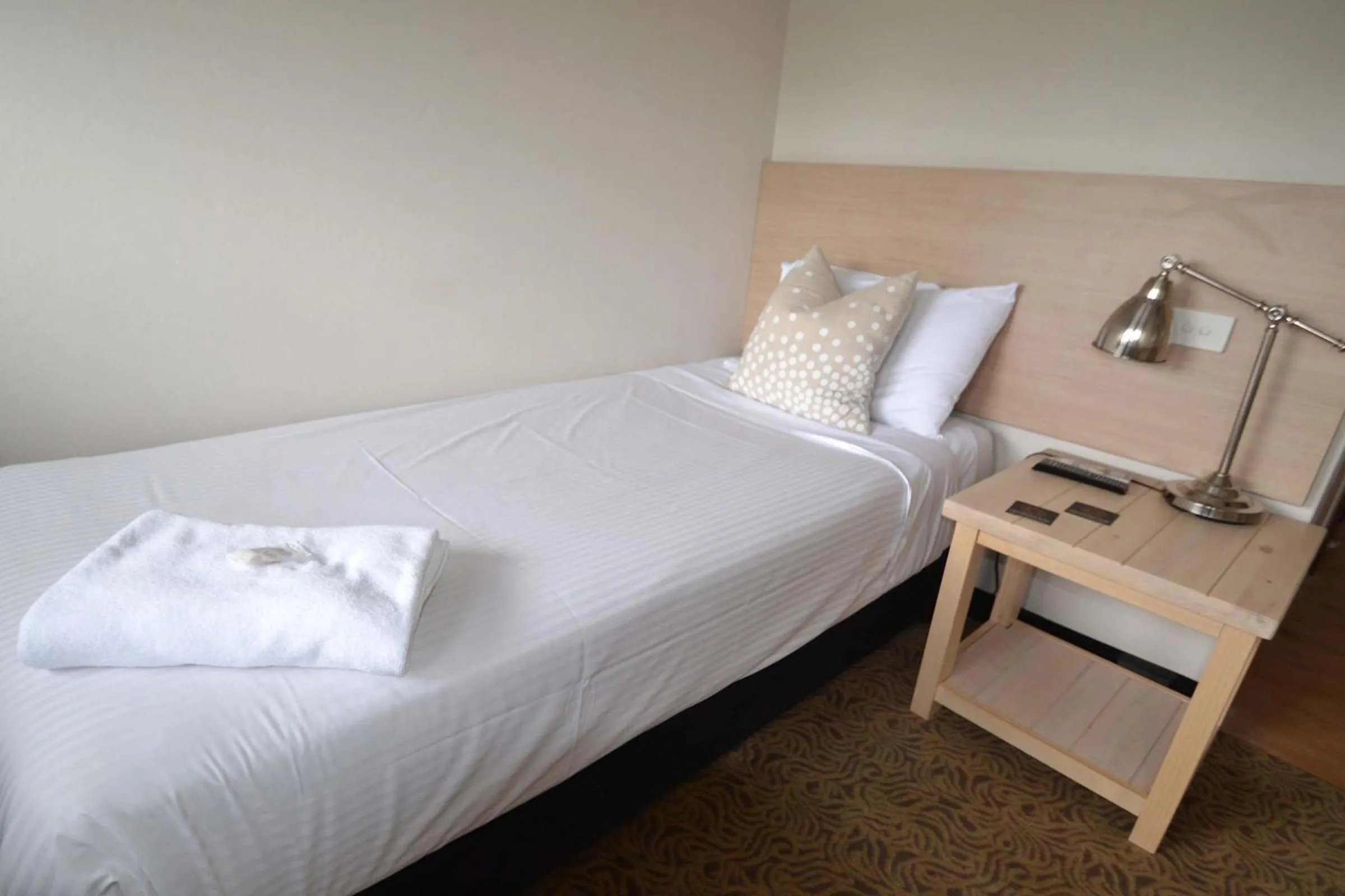 Bed in Crossroads Hotel