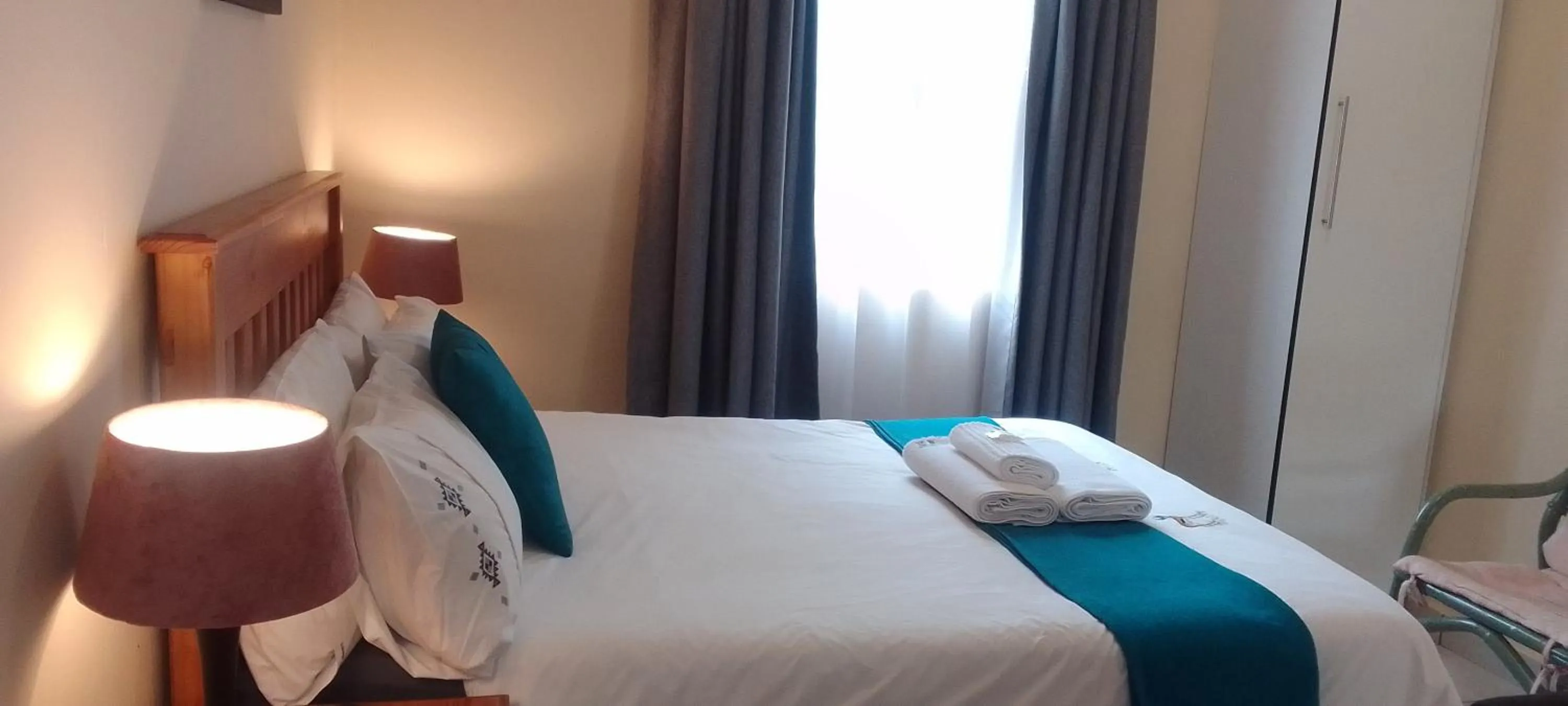 Bed in Sand River Cottages