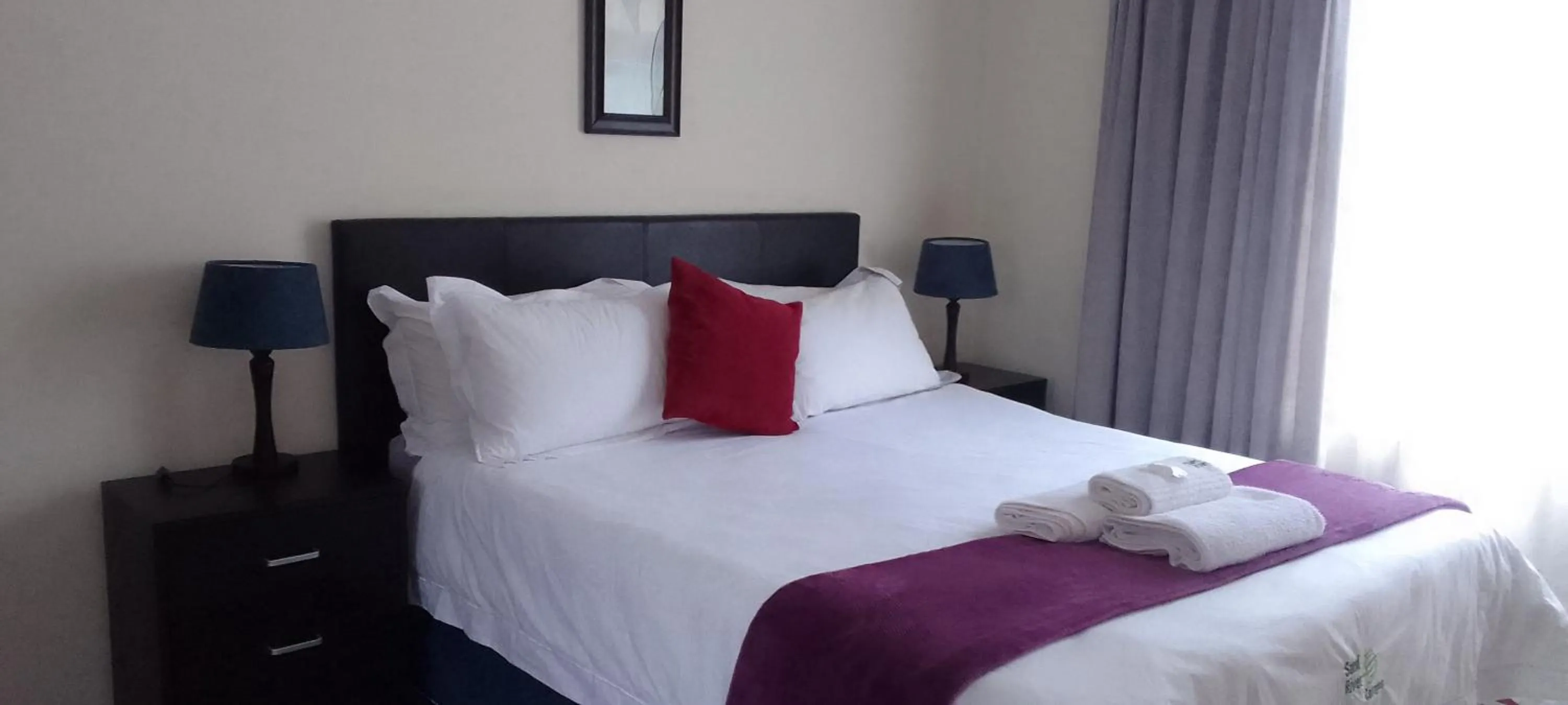 Bed in Sand River Cottages