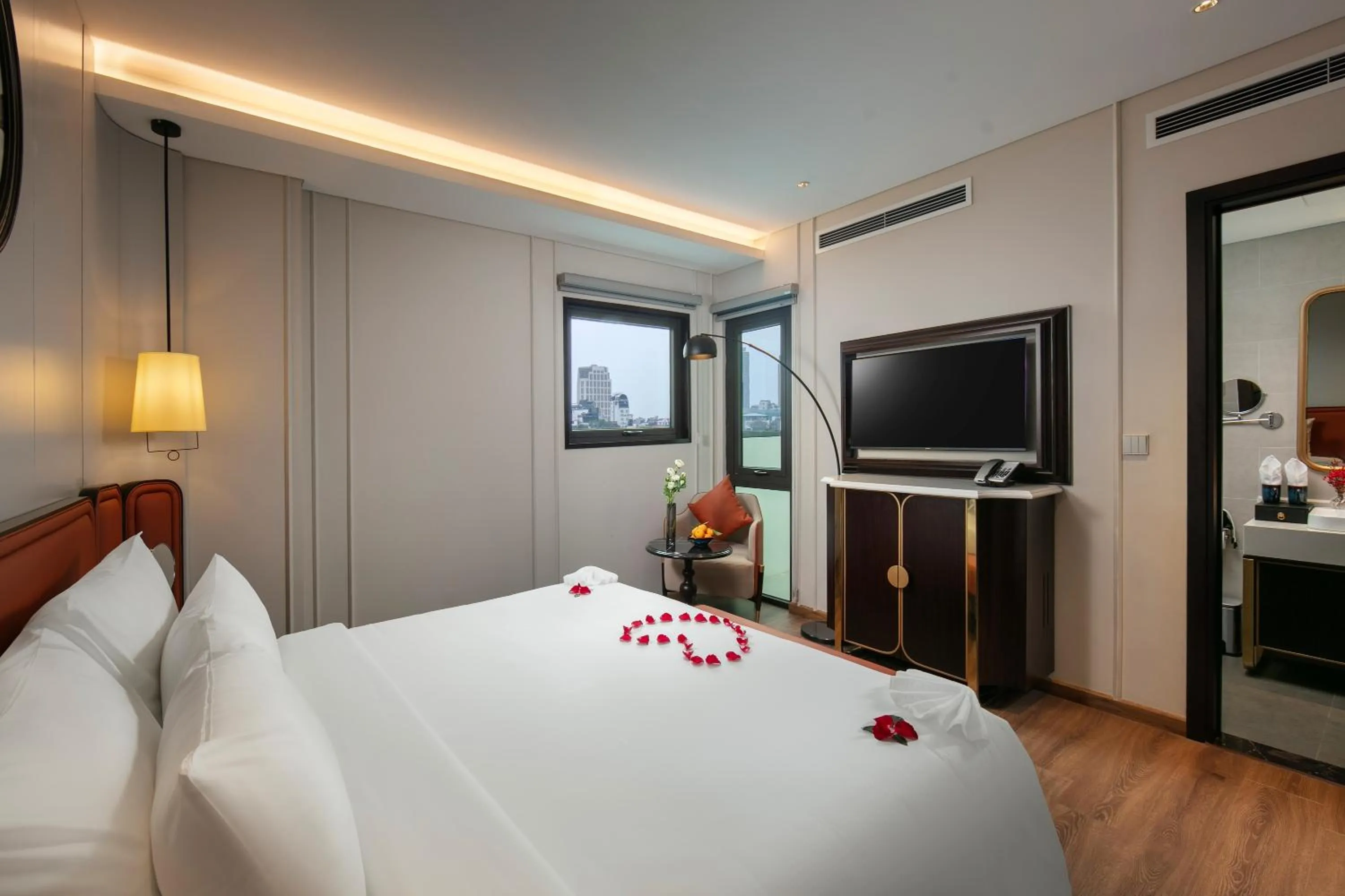 Bed in Le Premier Hotel & Rooftop Bar