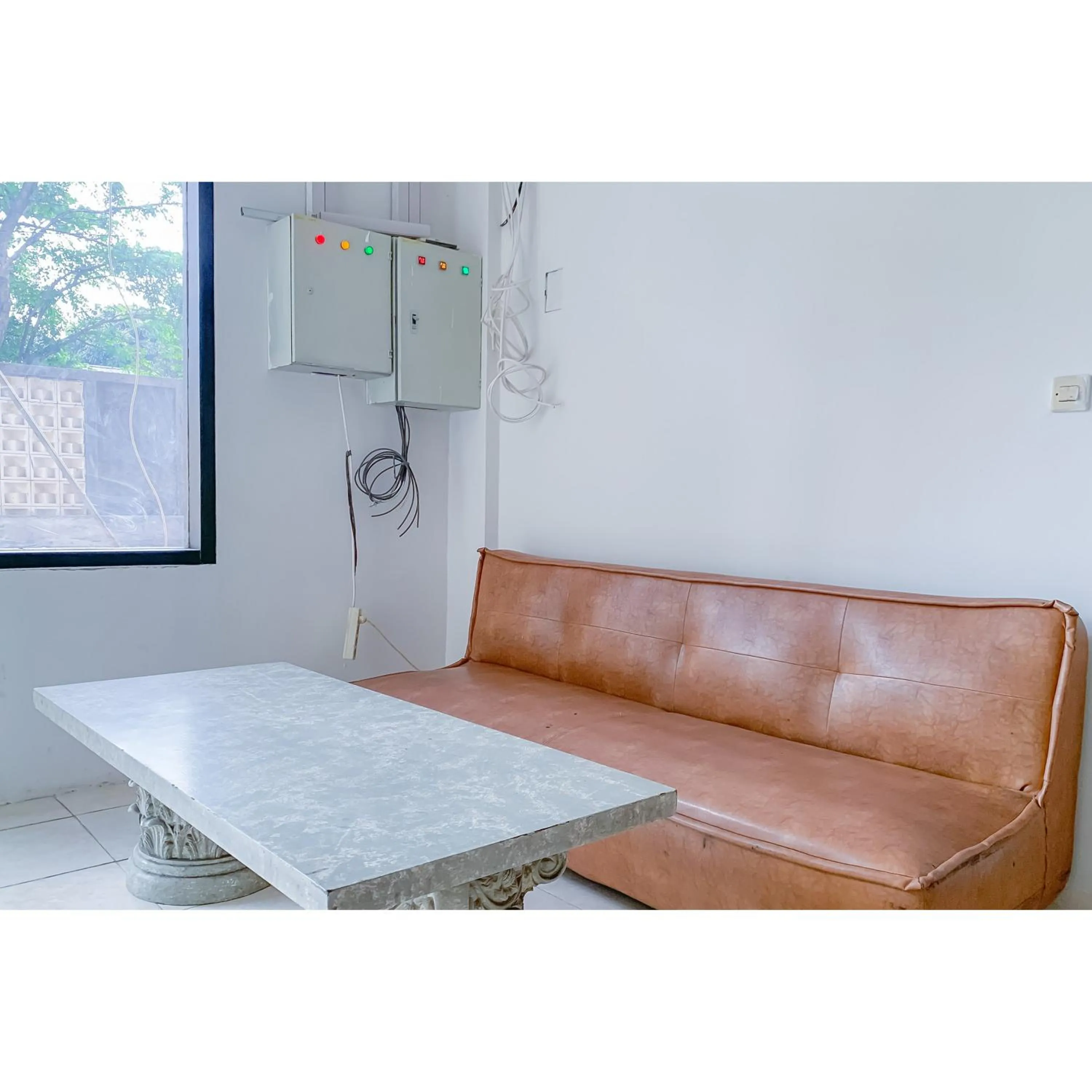 Seating area in RedDoorz Plus at D San Residence Buah Batu