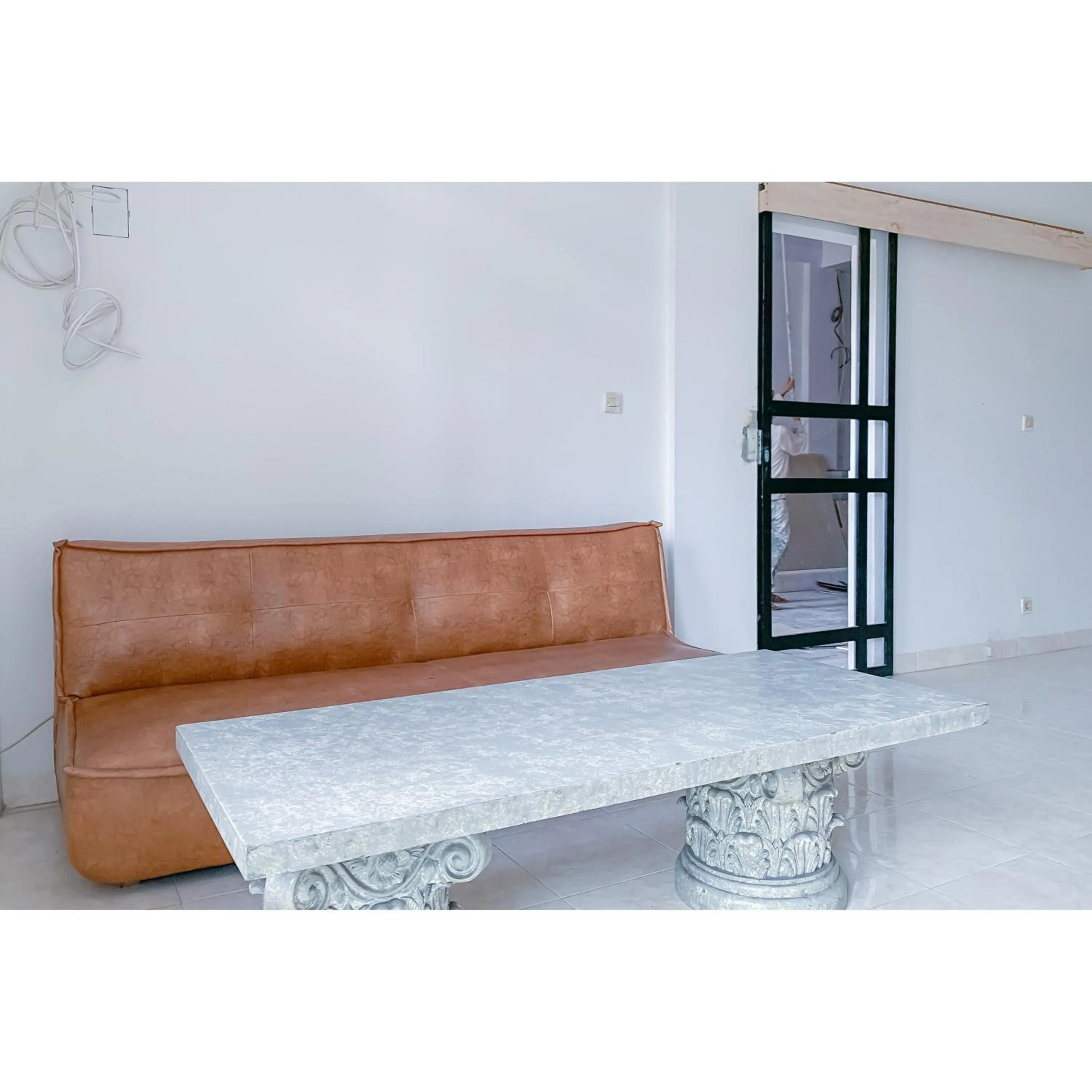 Seating area in RedDoorz Plus at D San Residence Buah Batu