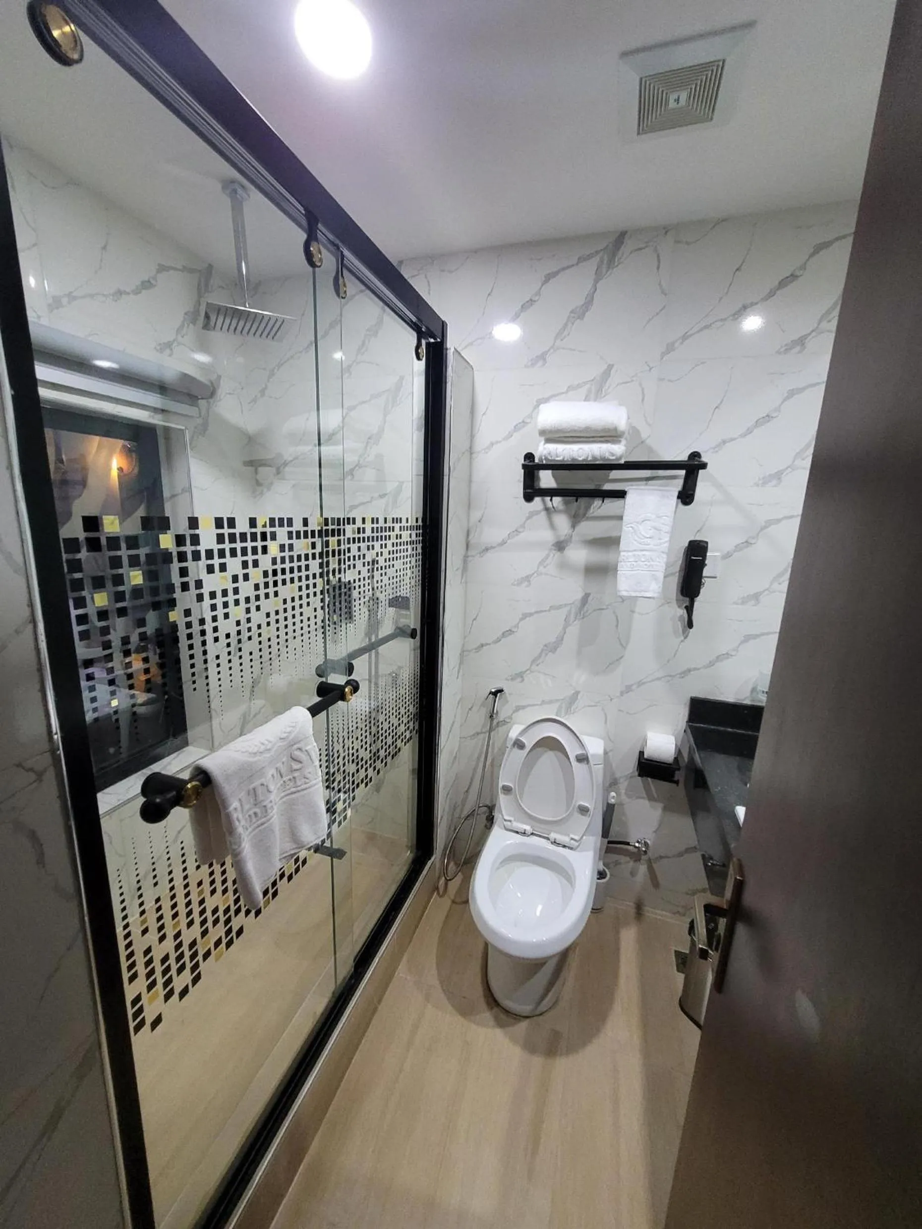 Toilet in Carlton Swiss Luxury Residency