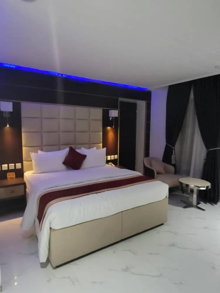 Bed in Carlton Swiss Luxury Residency