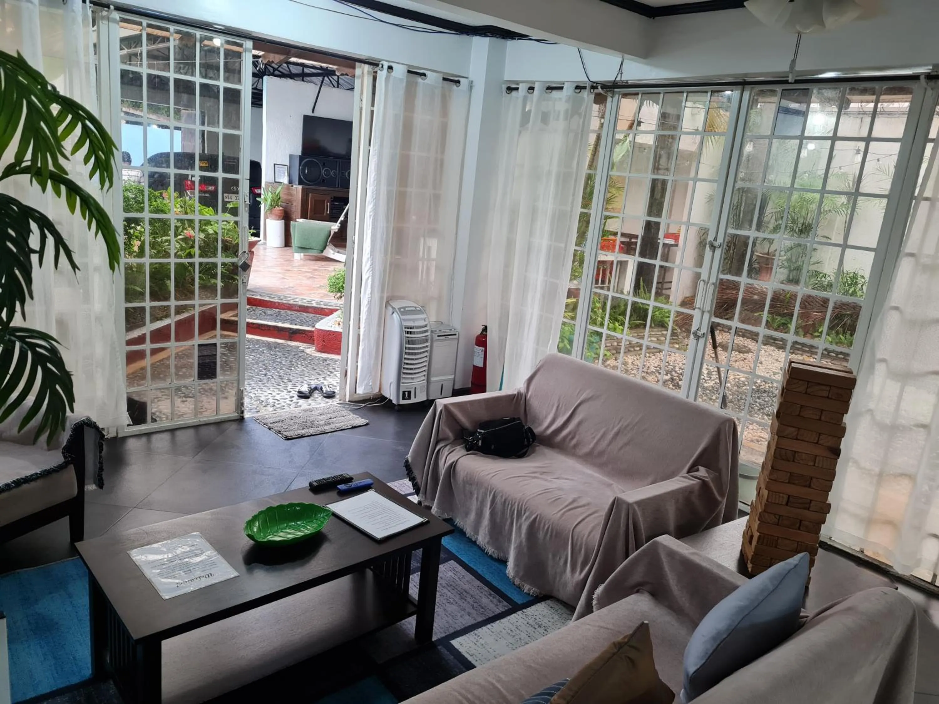 Communal lounge/ TV room in Casa Eliana Garden Villa by SMS Hospitality