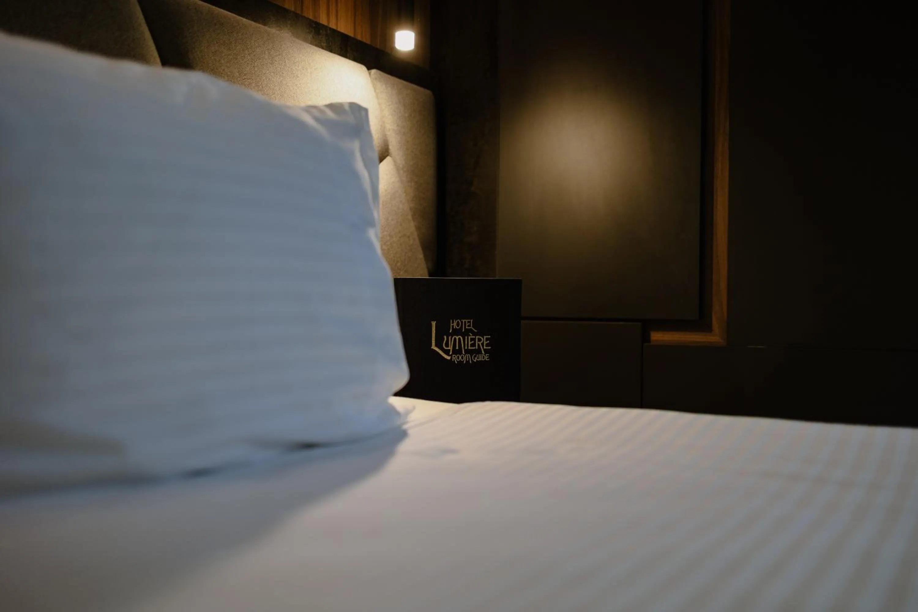 View (from property/room), Bed in Lumière Hotel Pool & SPA