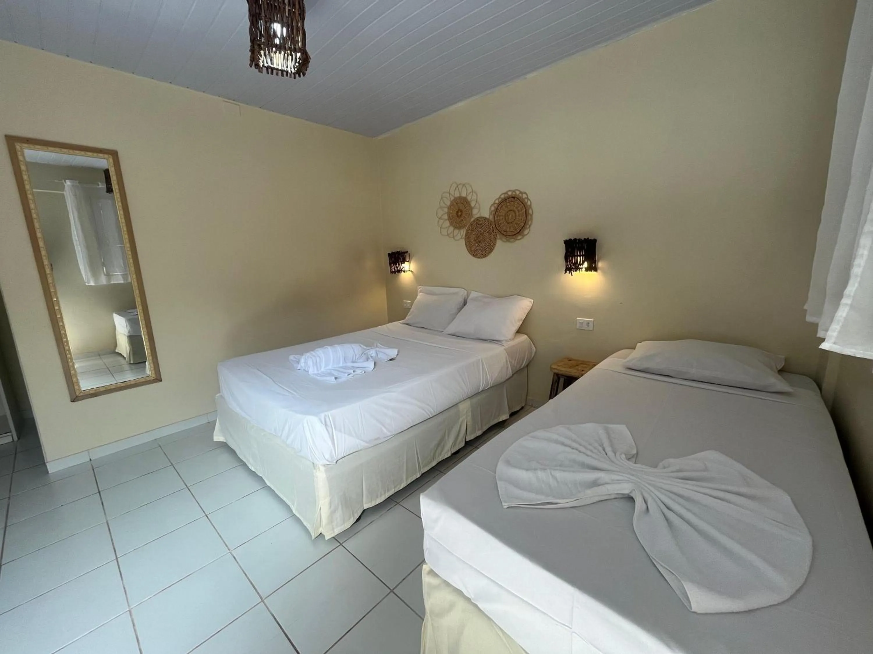 Bed in Pousada Flor de Merepe