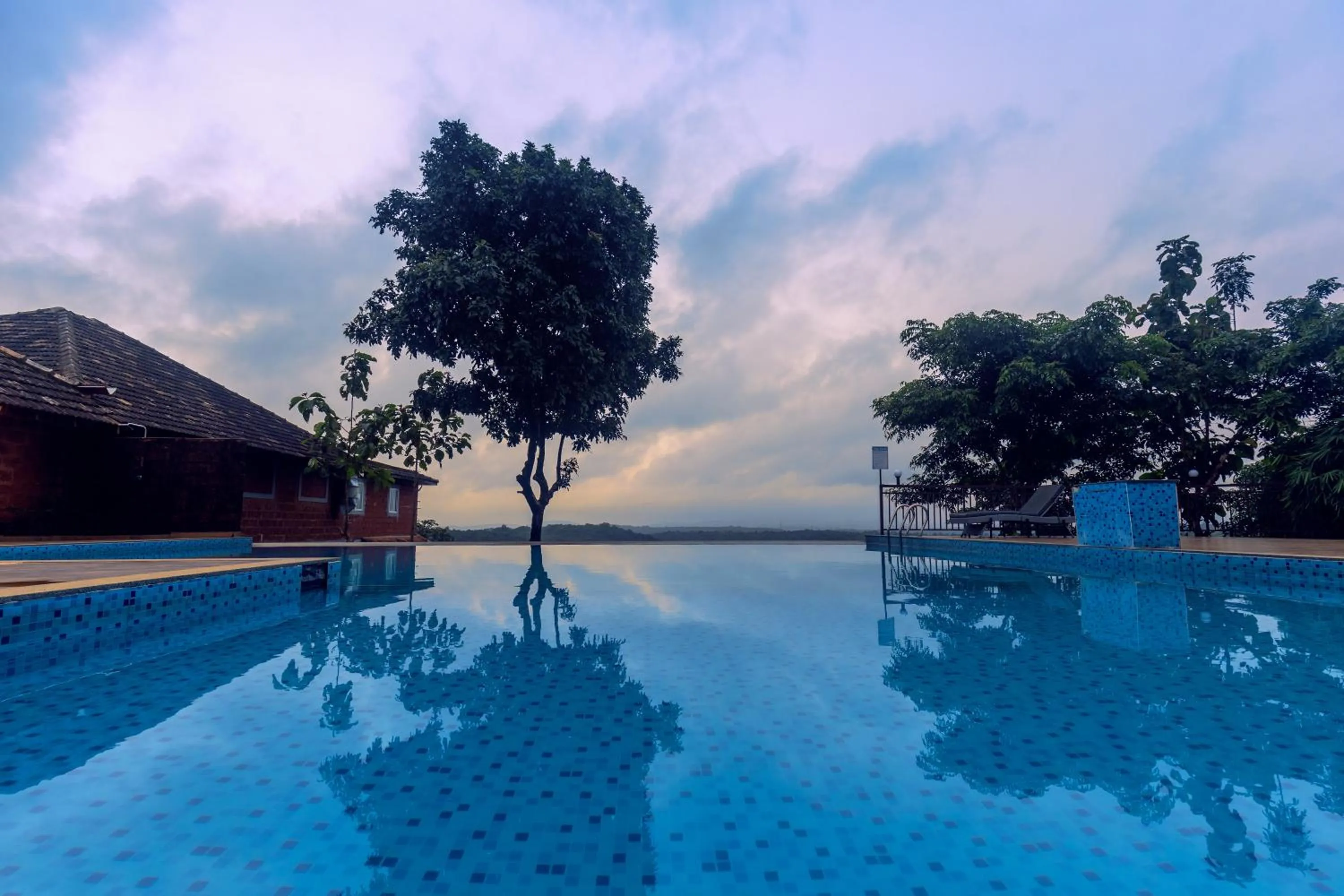 Swimming pool in SandalMist Resort and Spa