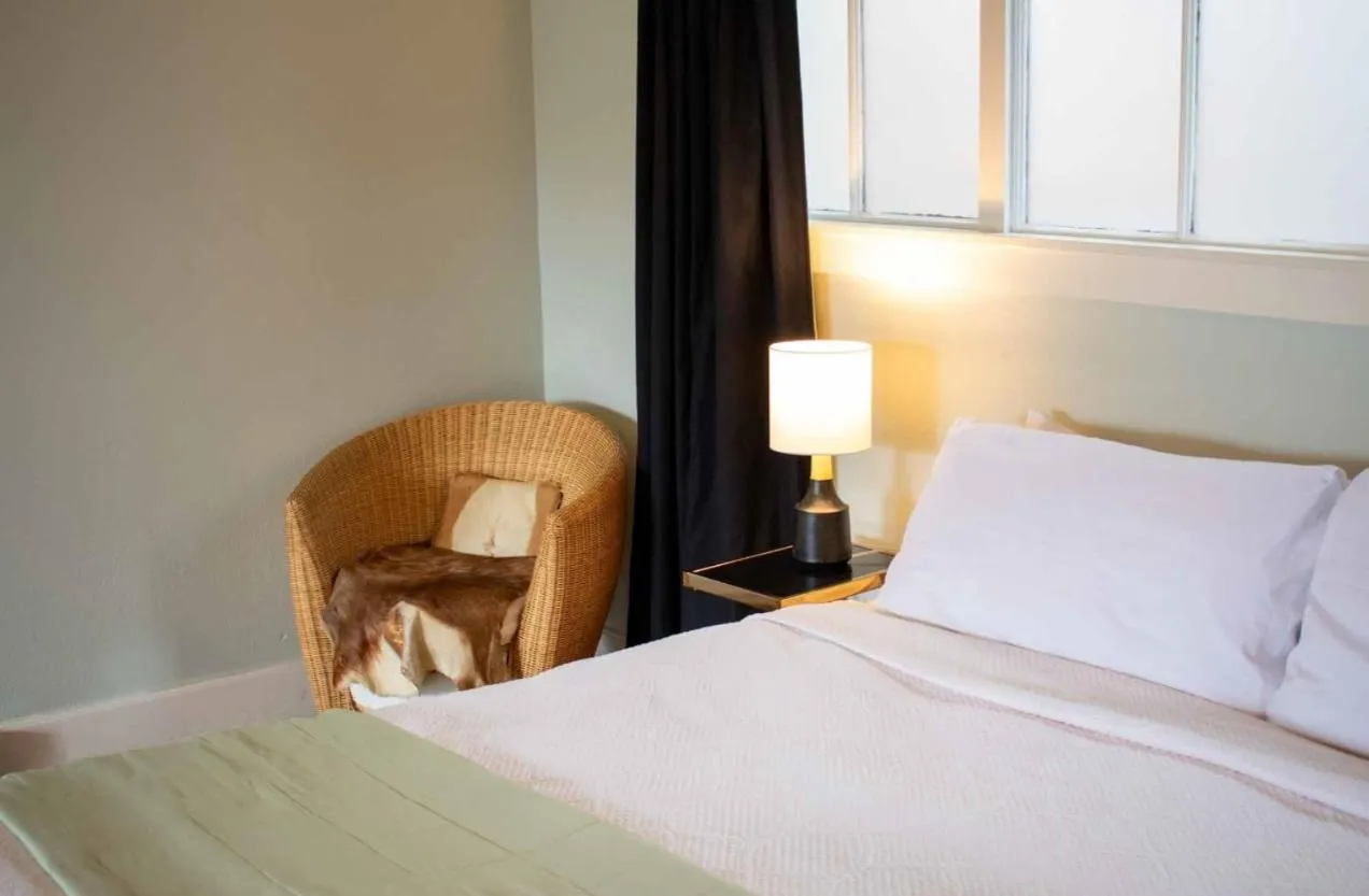 Bed in Dennen's Victorian Farmhouse