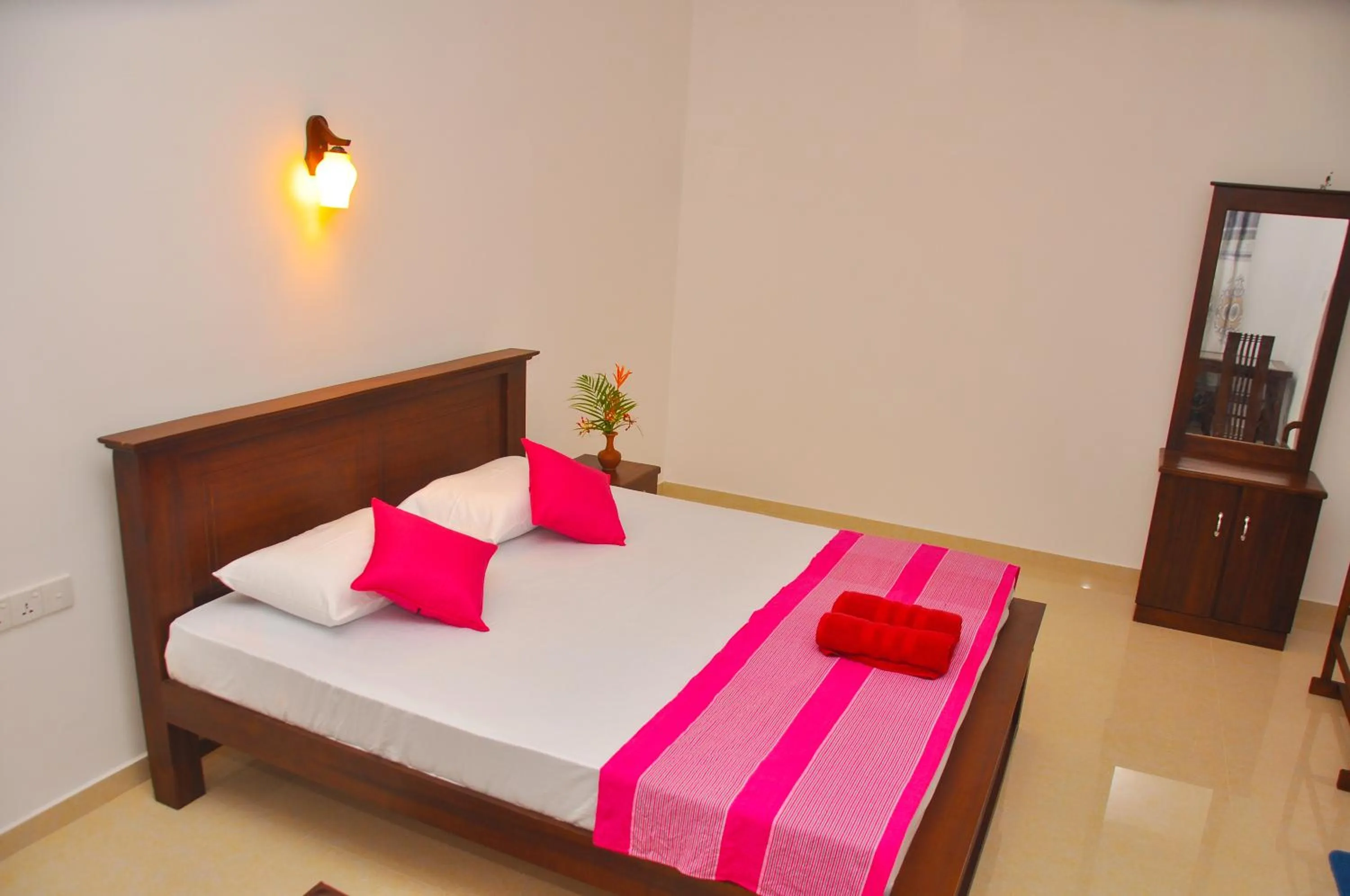 Bed in Hiru Resort Inn