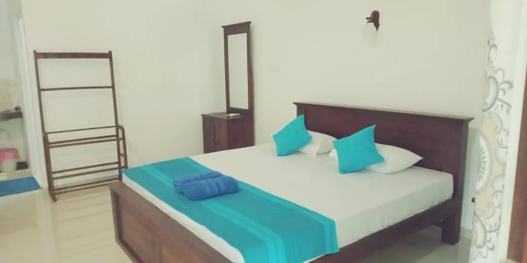 Bed in Hiru Resort Inn