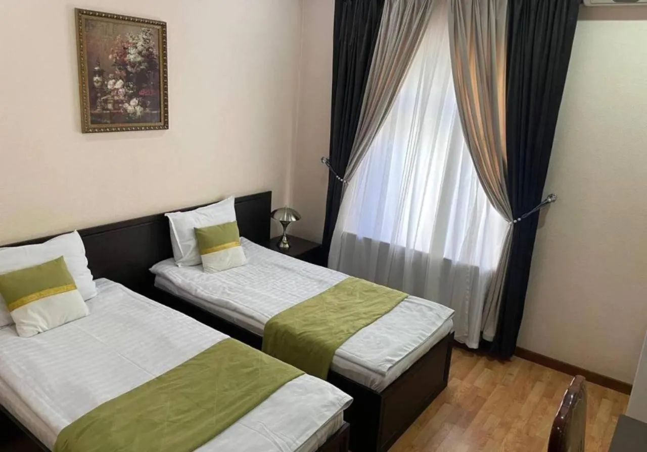 Bed in Marvarid Hotel